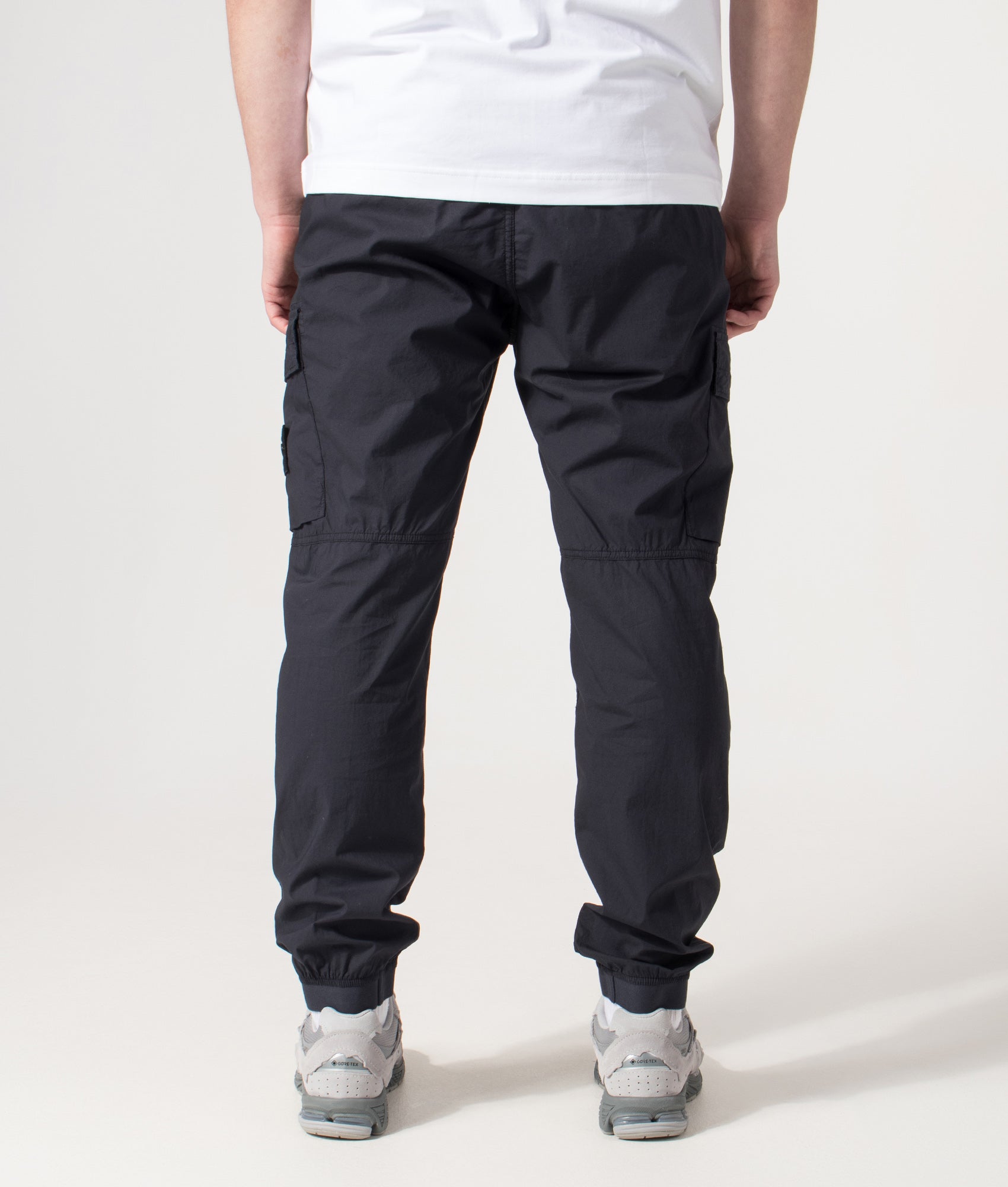 Stone Island Tapered Cargo Pants in Navy Blue at EQVVS Menswear. Back shot.