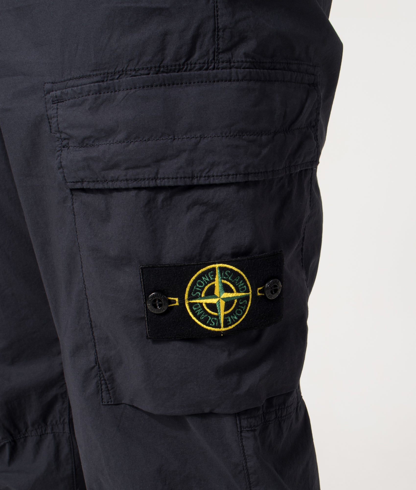 Stone Island Tapered Cargo Pants in Navy Blue at EQVVS Menswear. Detail shot.