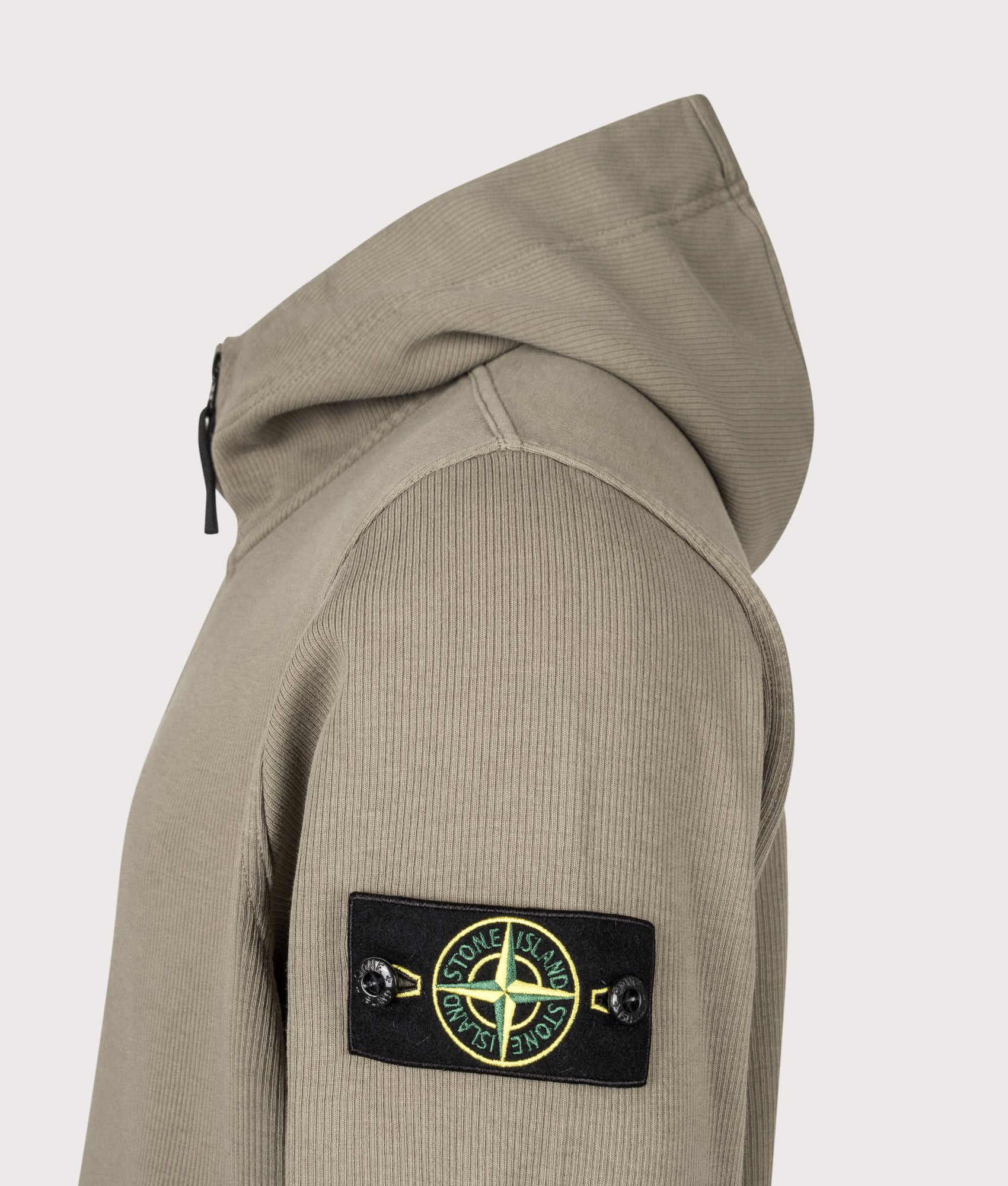 Stone Island Organic Cotton Interlock Zip through Hoodie in Military Green at EQVVS Menswear. Detail shot.