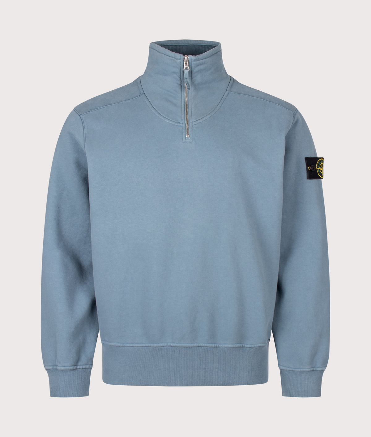Stone Island Comfort Fit Brushed Organic Fleece Quarter Zip Sweatshirt in Steel Blue at EQVVS Menswear. Front shot.