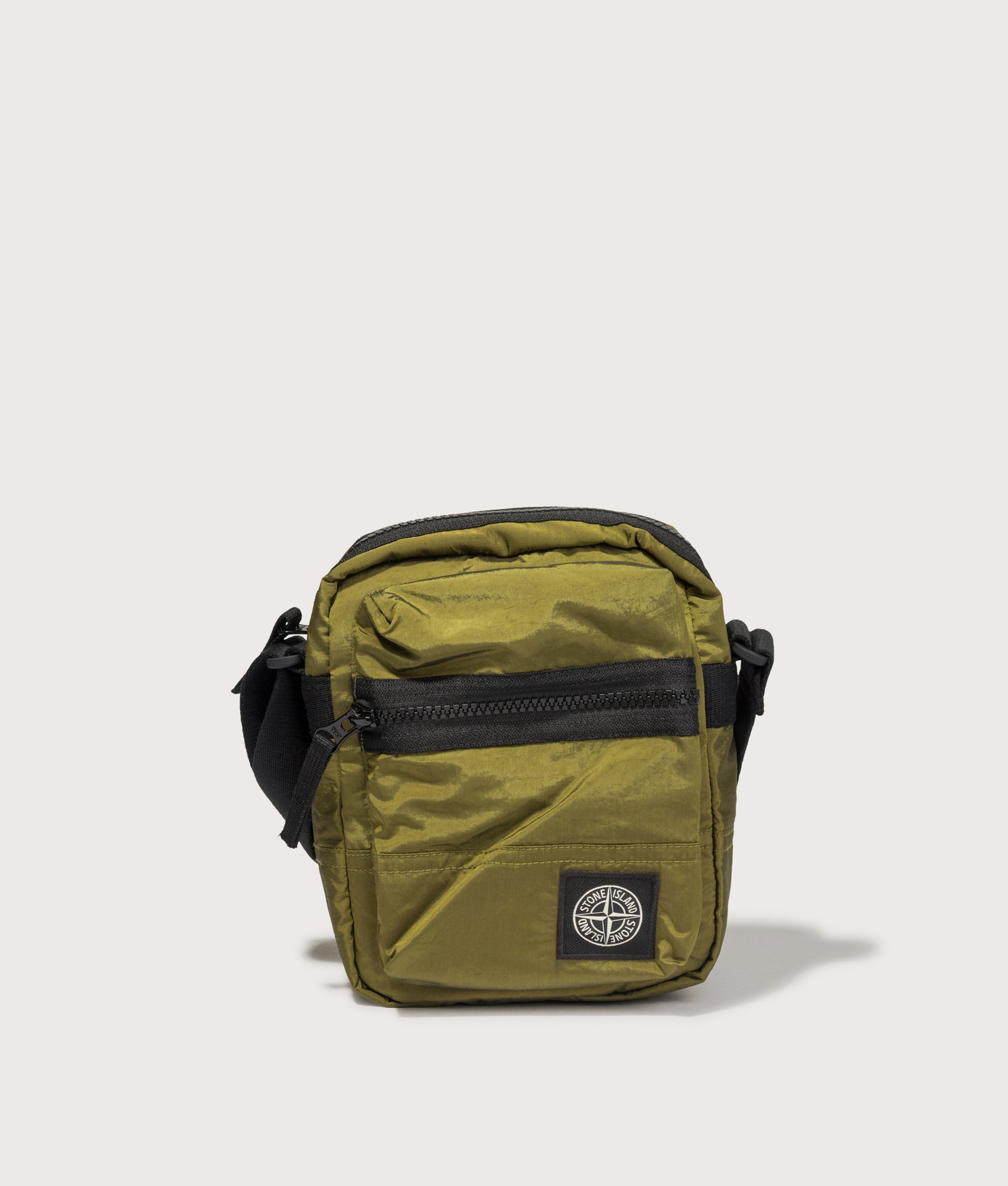 Stone Island Coated Nylon Metal in Econyl® Crossbody Bag in Cactus at EQVVS Menswear. Front shot.