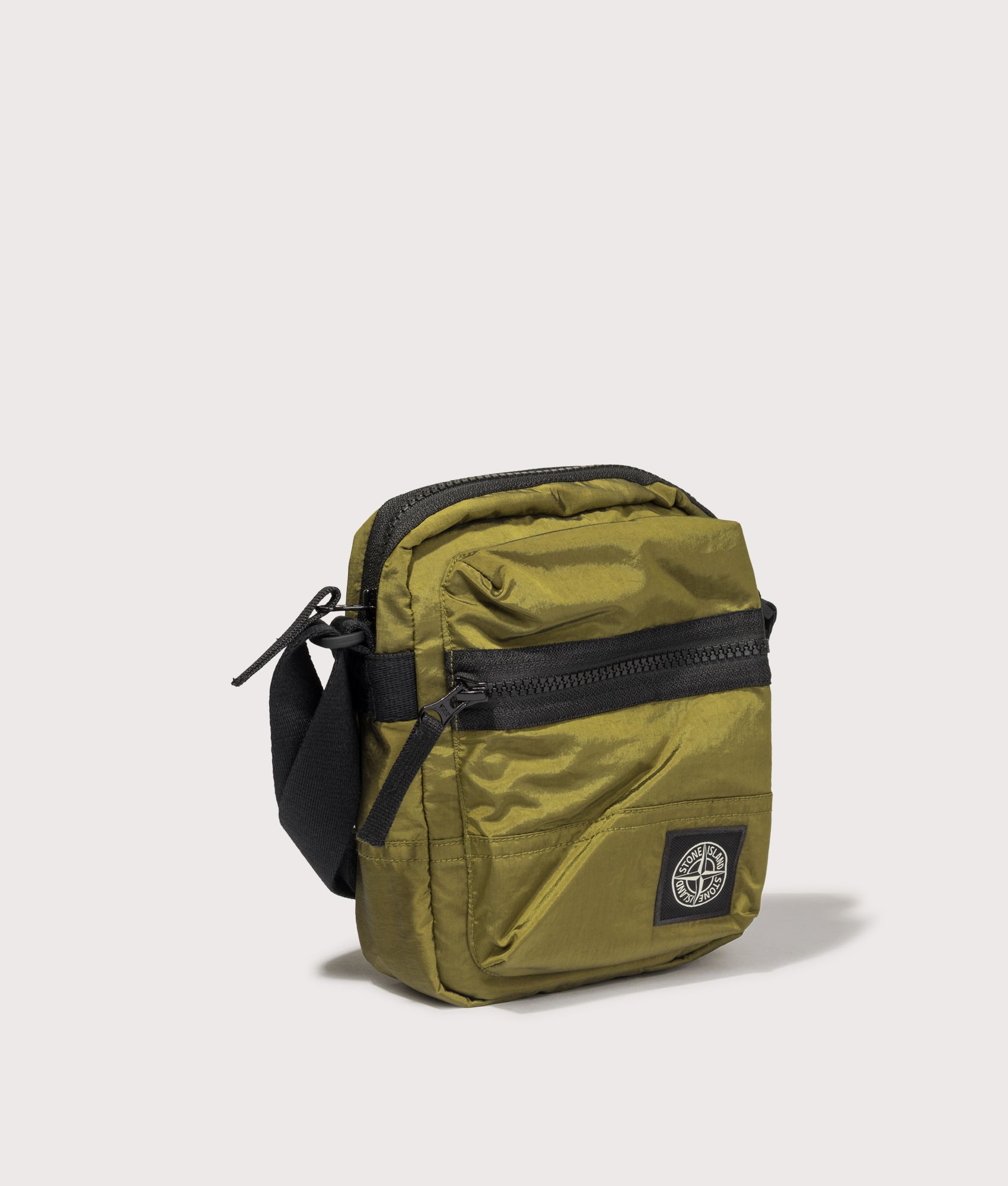 Stone Island Coated Nylon Metal in Econyl® Crossbody Bag in Cactus at EQVVS Menswear. Angled front shot.