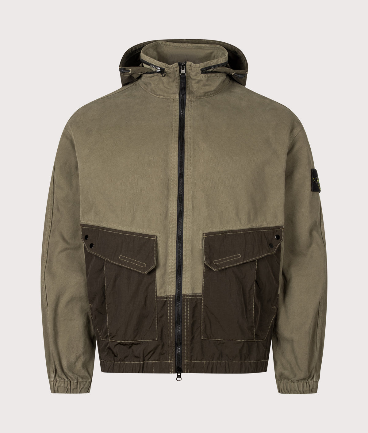 Stone Island Zip Through Lightweight Hooded Jacket in Military Green at EQVVS Menswear. Front shot with hood.