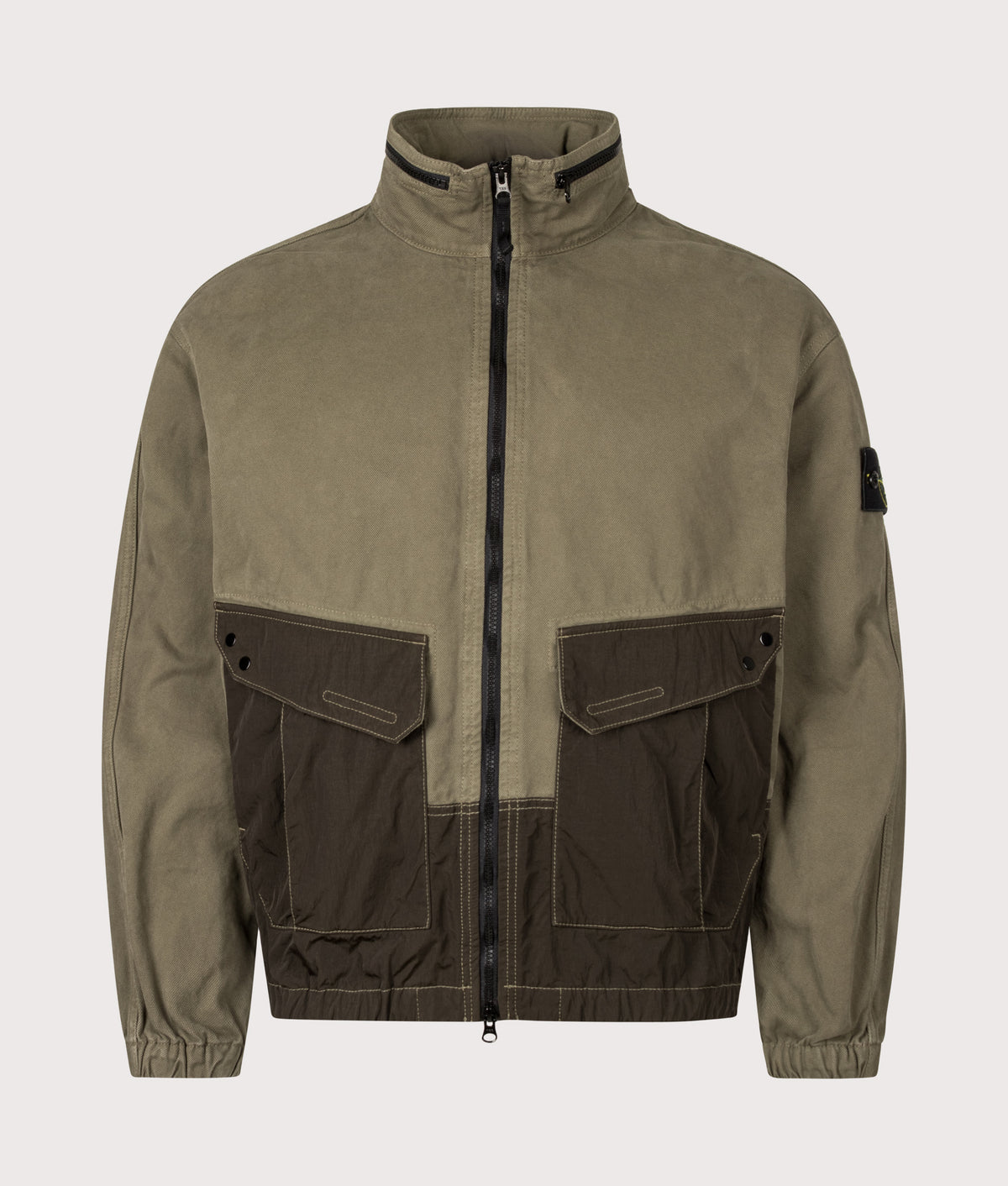 Stone Island Zip Through Lightweight Hooded Jacket in Military Green at EQVVS Menswear. Front shot.