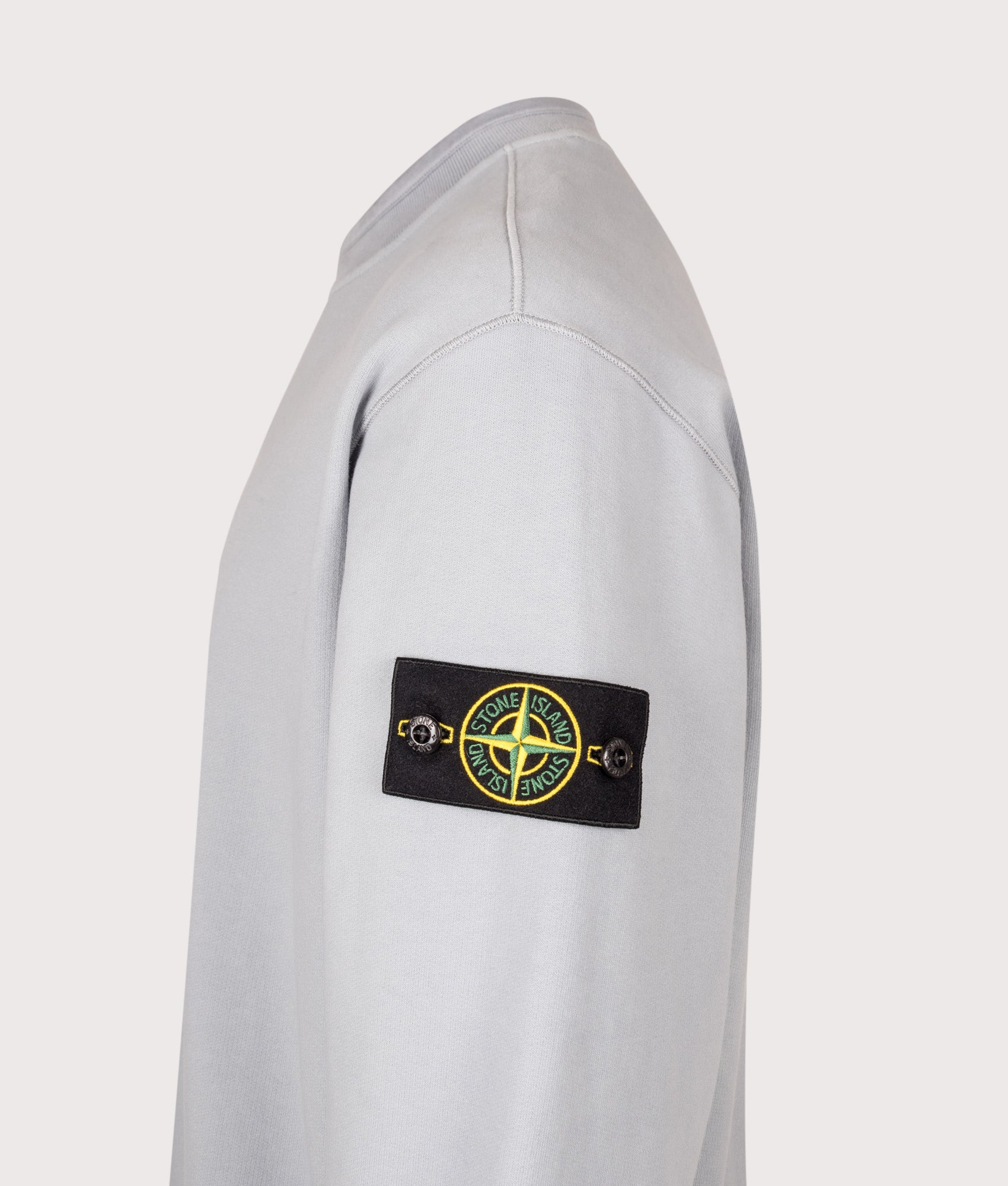 Stone Island Oversized Fit Brushed Organic Cotton Fleece Sweatshirt in Ash Grey at EQVVS Menswear. Detail shot.