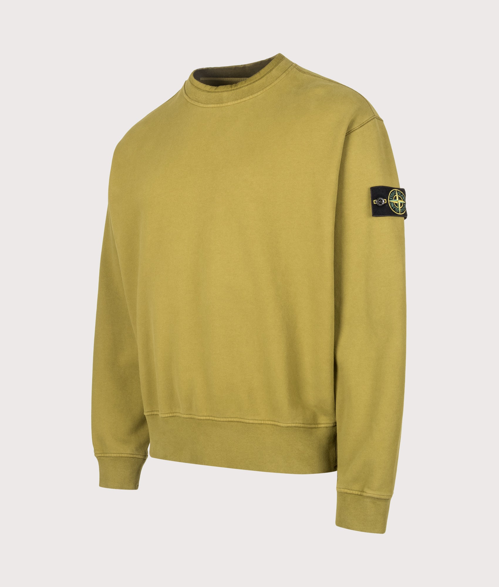 Stone Island Oversized Fit Brushed Organic Cotton Fleece Sweatshirt in Cactus at EQVVS Menswear. Angled front shot.