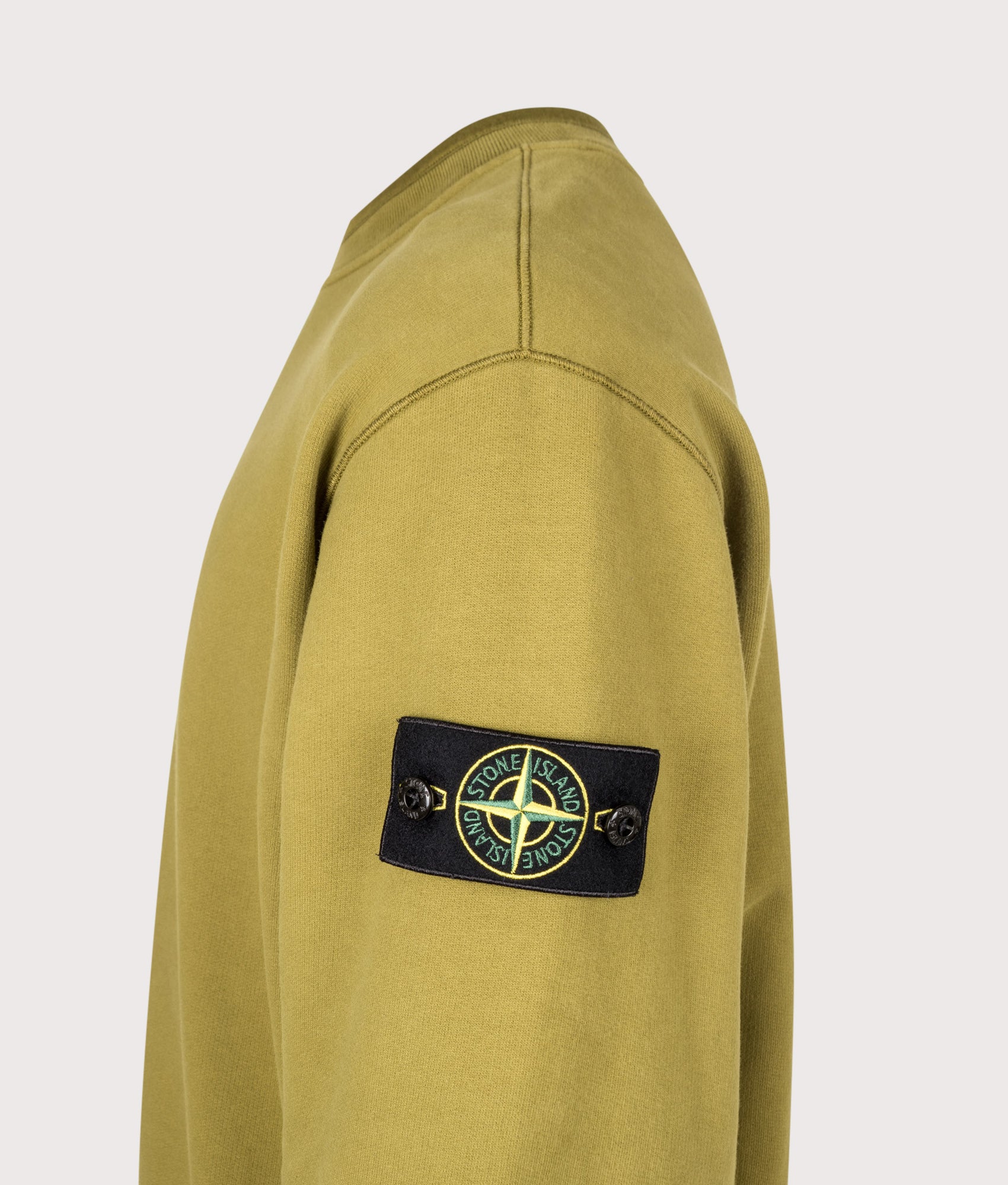 Stone Island Oversized Fit Brushed Organic Cotton Fleece Sweatshirt in Cactus at EQVVS Menswear. Detail shot.