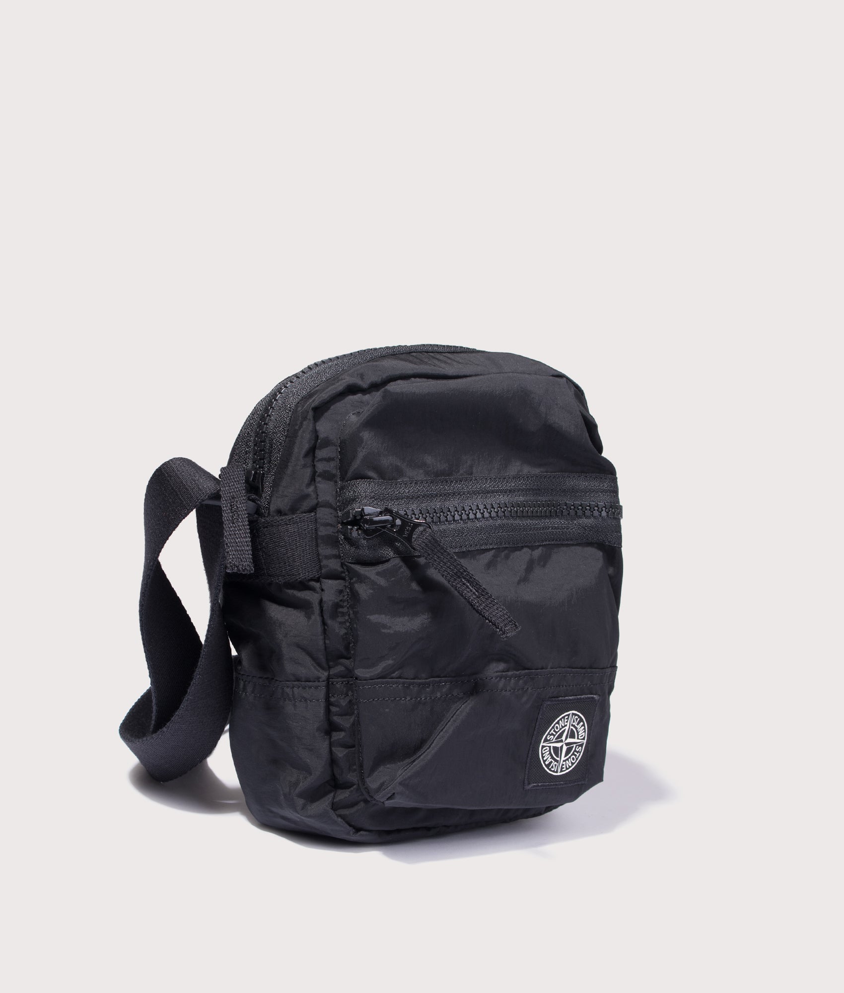 Cross Body Sleeve Body Bag in Black | Stone Island | EQVVS | Front angle shot 