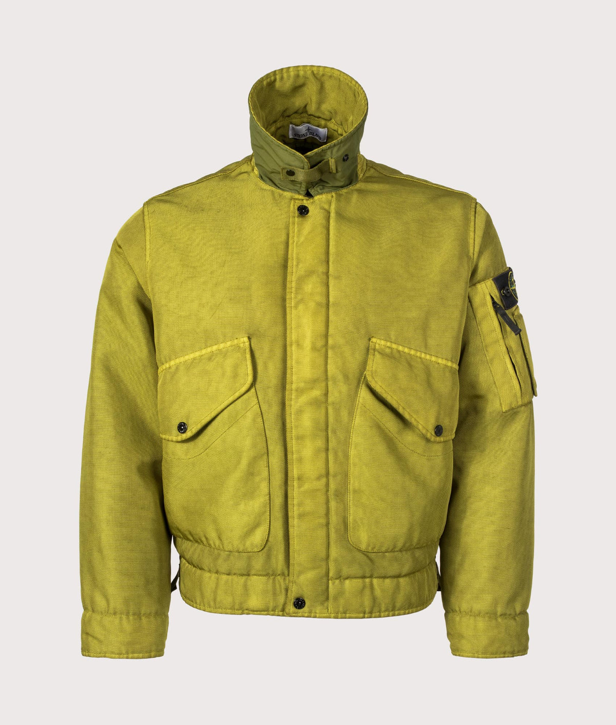 Stone Island Dense Oxford Nylon-TC Jacket in Cactus at EQVVS Menswear. Collar up shot.