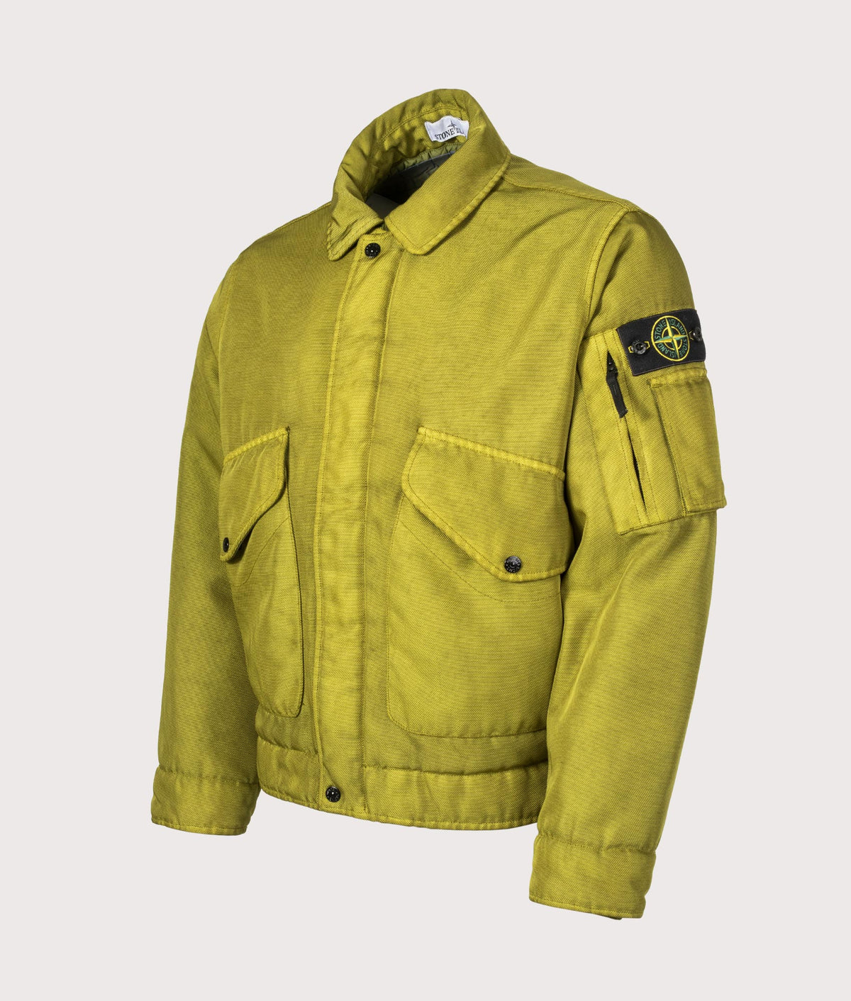 Stone Island Dense Oxford Nylon-TC Jacket in Cactus at EQVVS Menswear. Angled front shot.