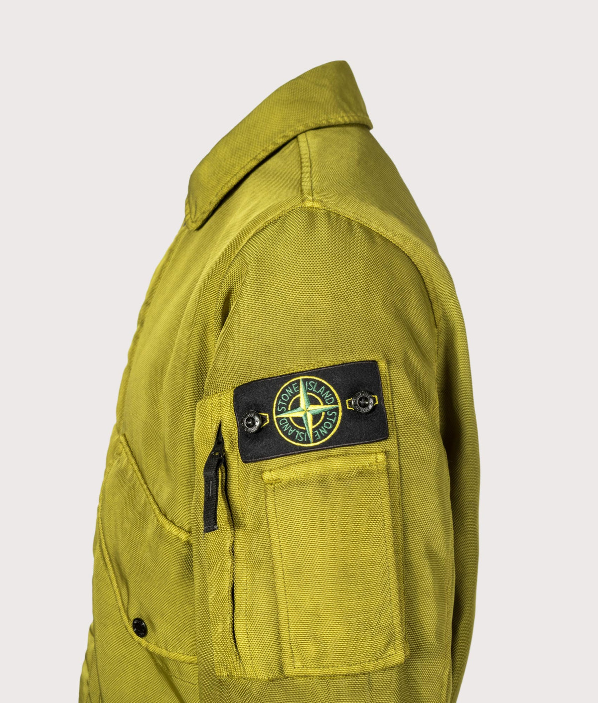 Stone Island Dense Oxford Nylon-TC Jacket in Cactus at EQVVS Menswear. Detail shot.