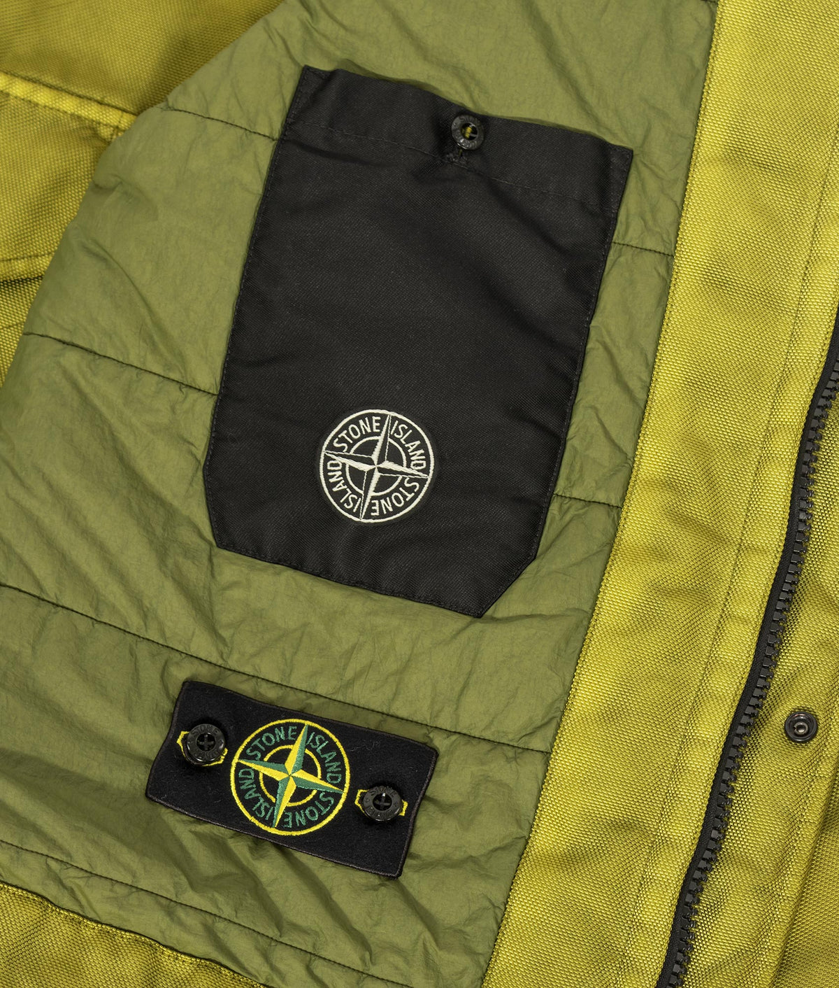 Stone Island Dense Oxford Nylon-TC Jacket in Cactus at EQVVS Menswear. Detail shot.