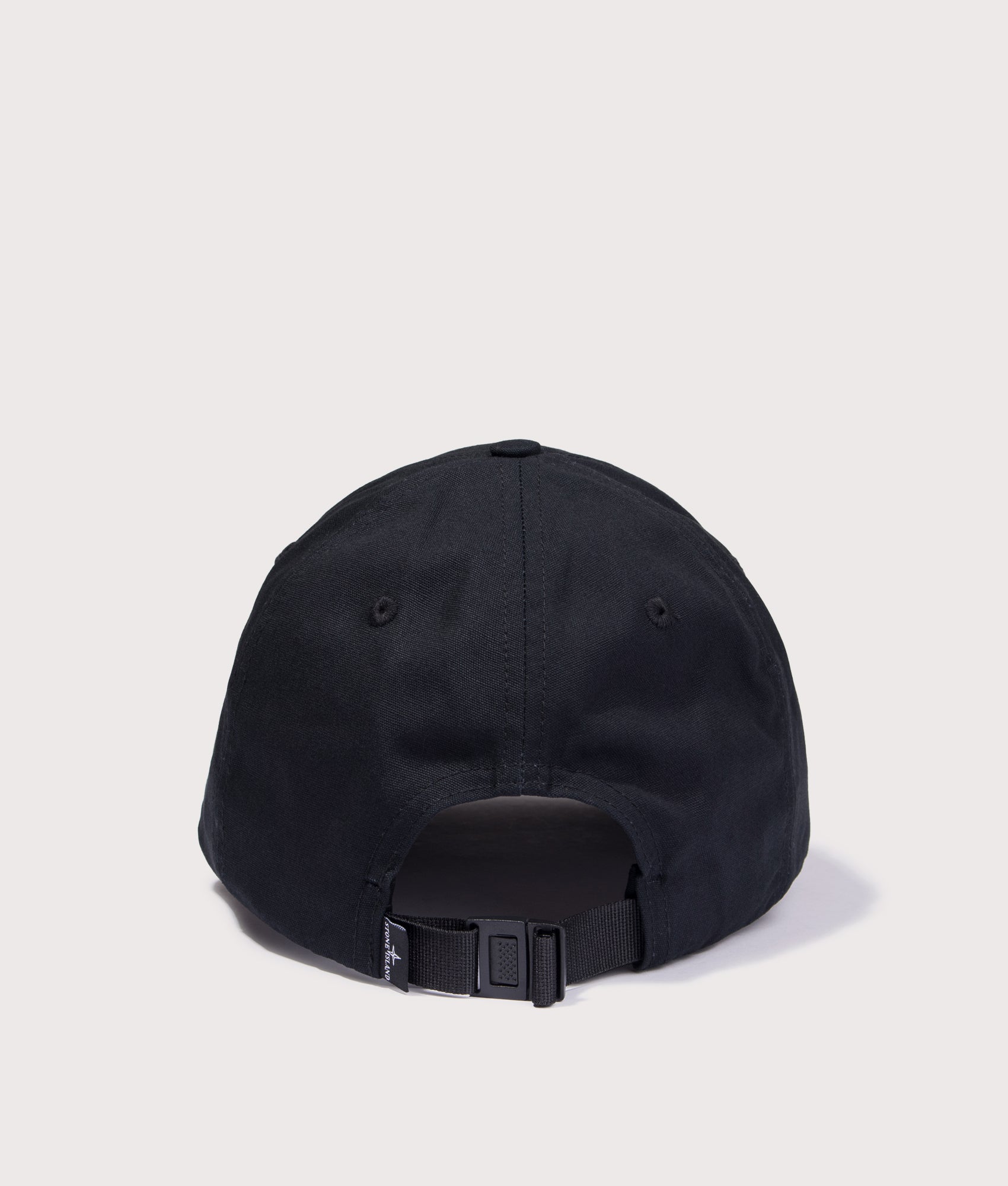 Stone Island Cotton Reps Compass Baseball Cap in Black at EQVVS Menswear. Back shot.