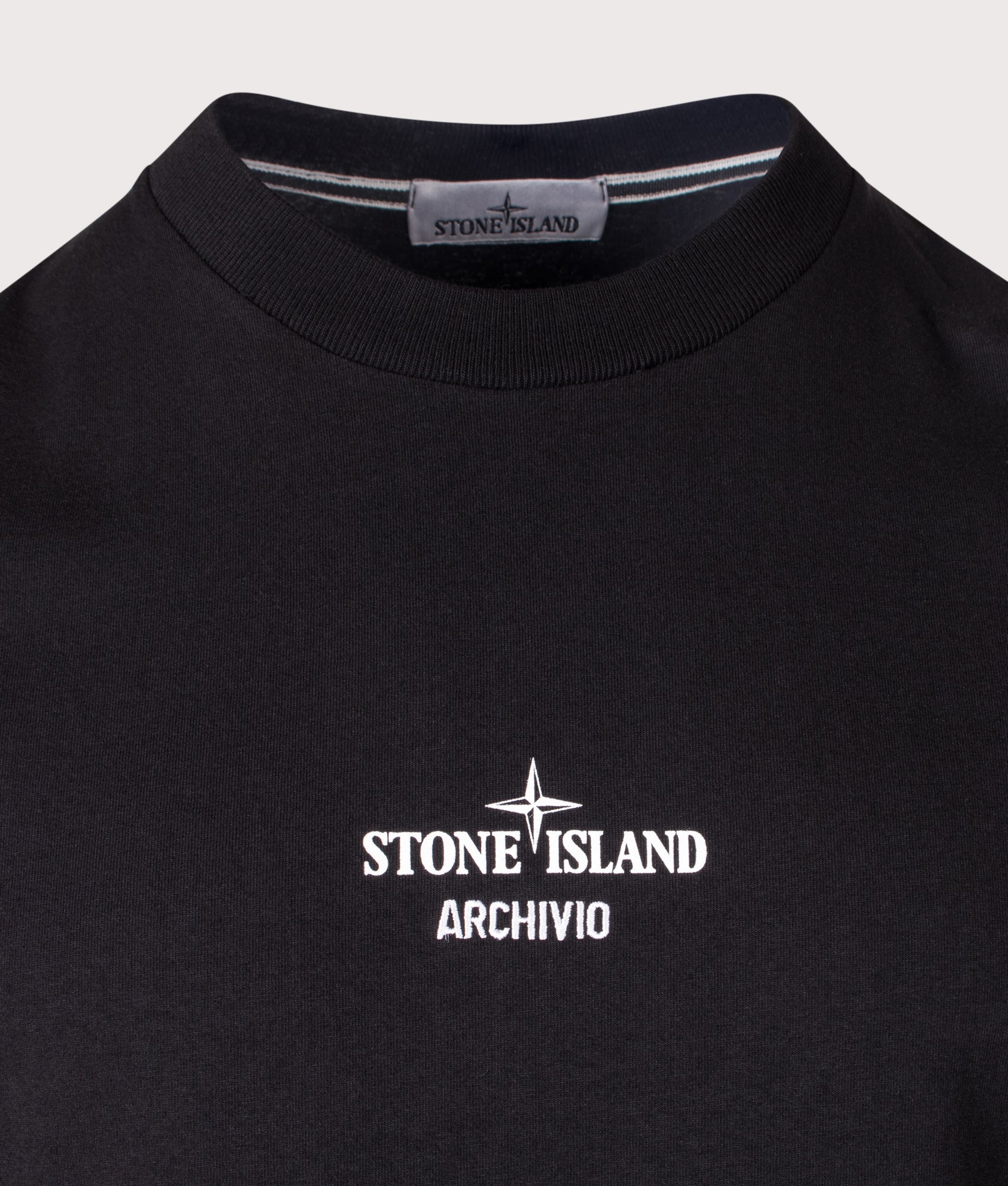 Stone Regular Fit ‘ARCHIVIO’ Print T-Shirt in Black at EQVVS Menswear. Detail shot.