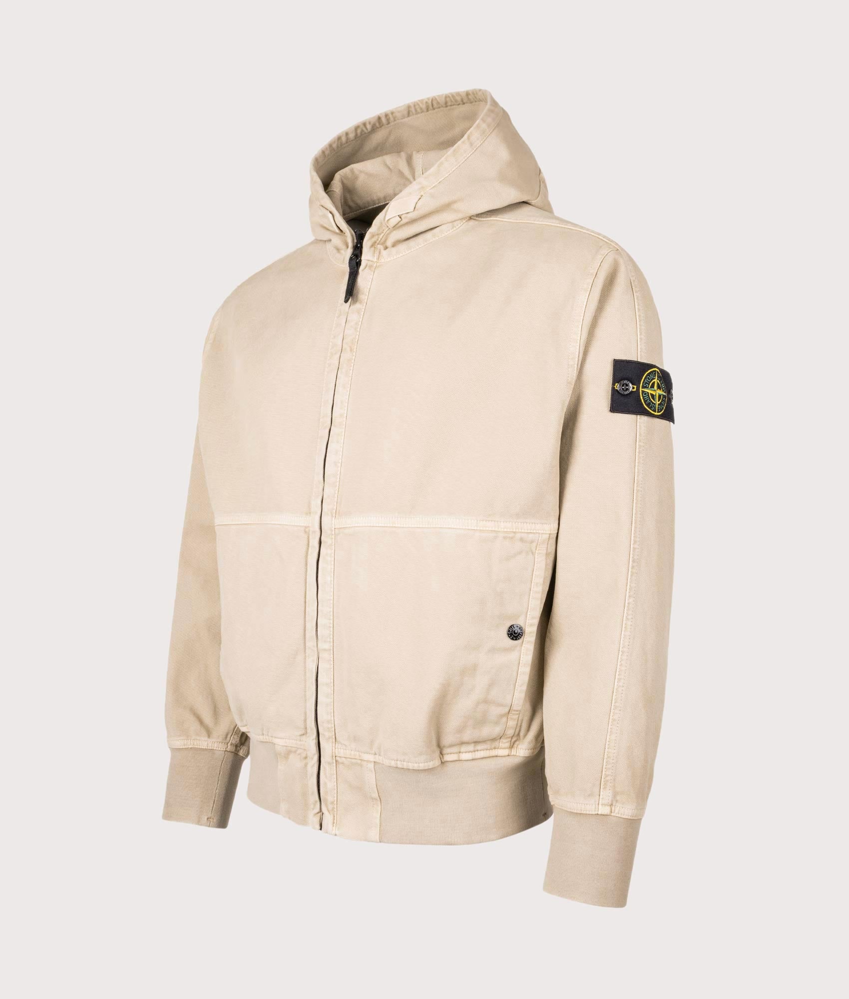 Stone Island Panama ‘Old’ Effect Zip Through Jacket in Desert Sand at EQVVS Menswear. Angled front shot.