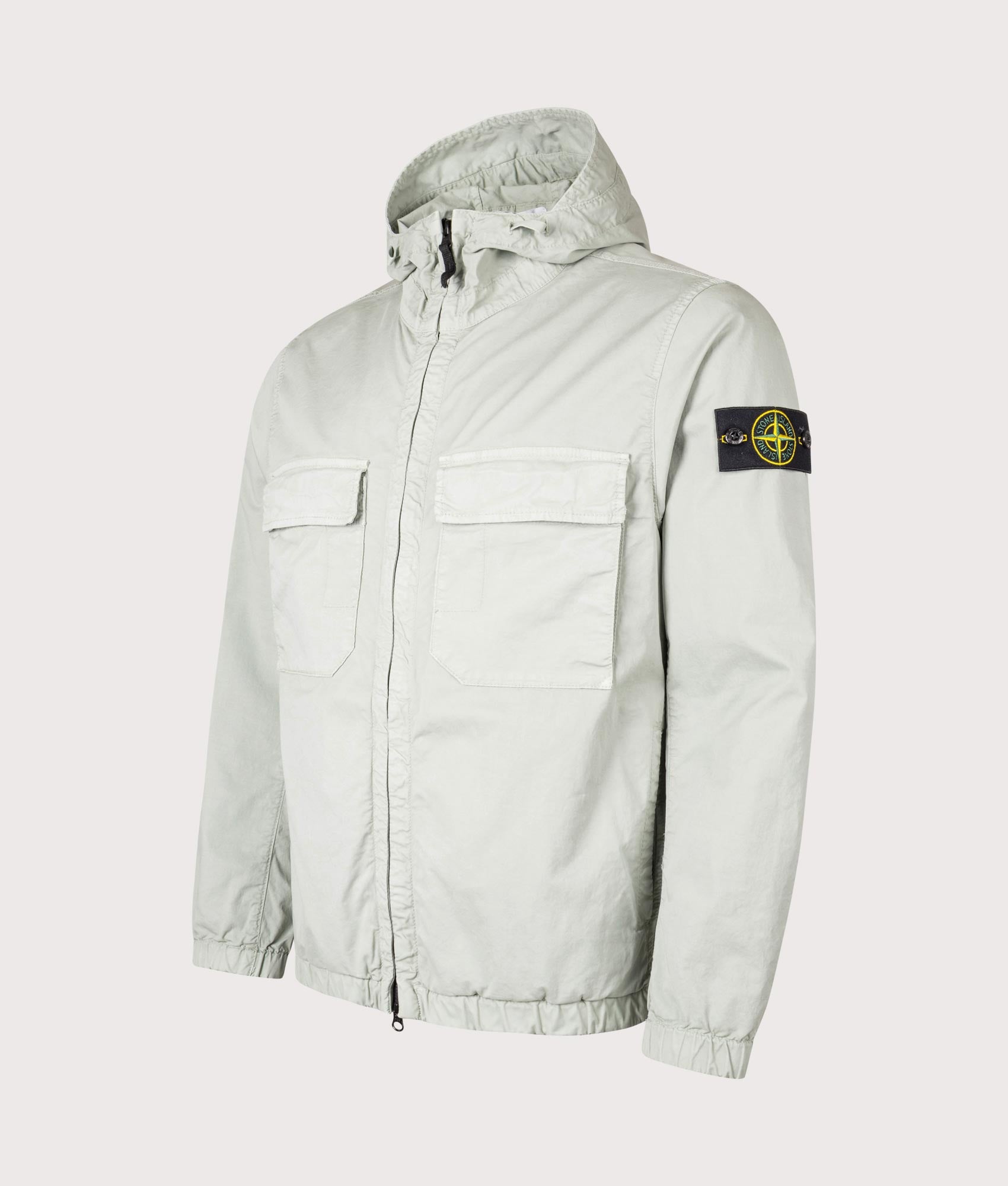 Stone Island Hooded Field Jacket in Sage at EQVVS Menswear. Angled front shot. 