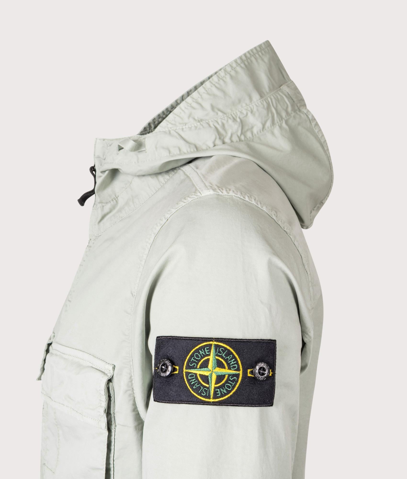 Stone Island Hooded Field Jacket in Sage at EQVVS Menswear. Detail shot.