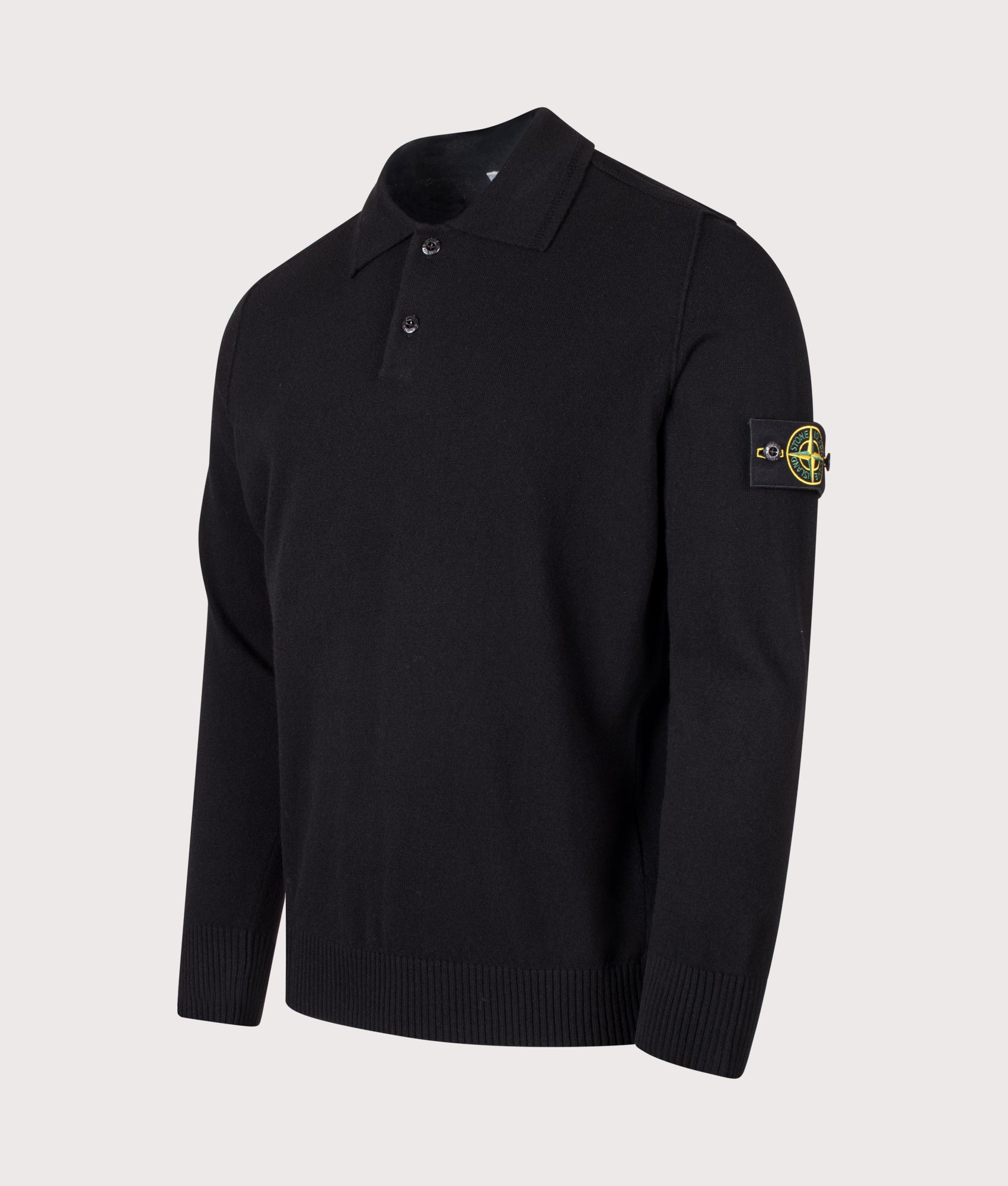 Stone Island Light RWS Geelong Wool Polo Collar Jumper in Black at EQVVS Menswear. Angled front shot.