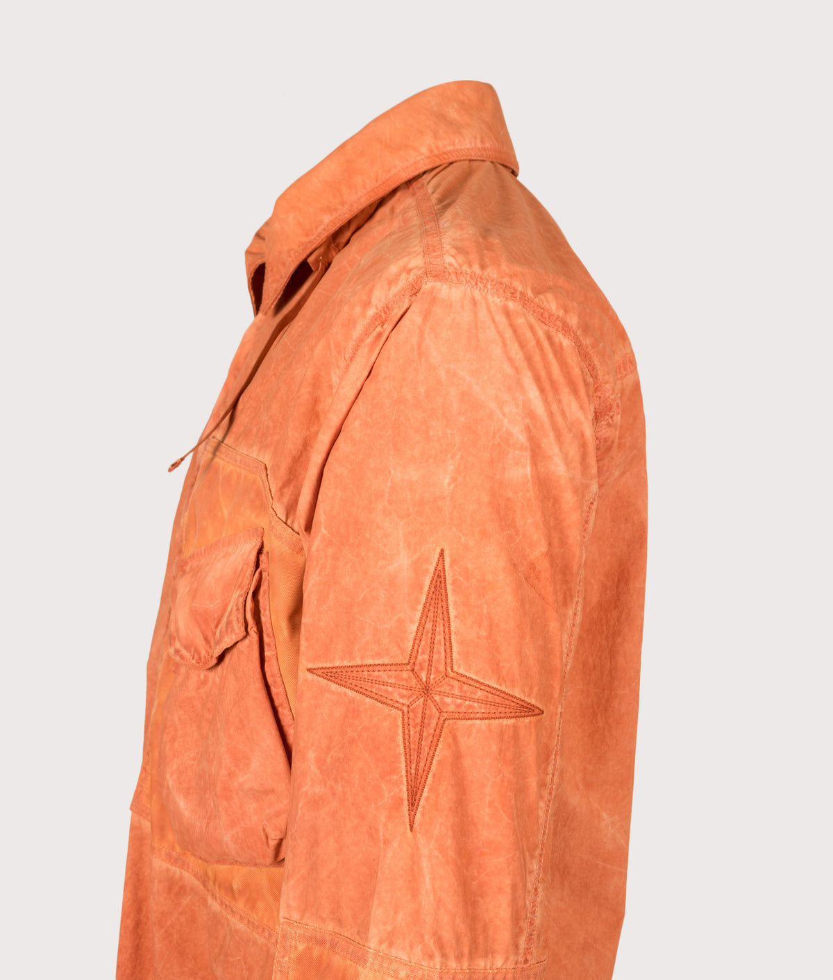 Stone Island Uneven Pigment Dyed Nylon Smerigliato + Nylon Canvas Overshirt in Burnt Orange at EQVVS Menswear. Detail shot.