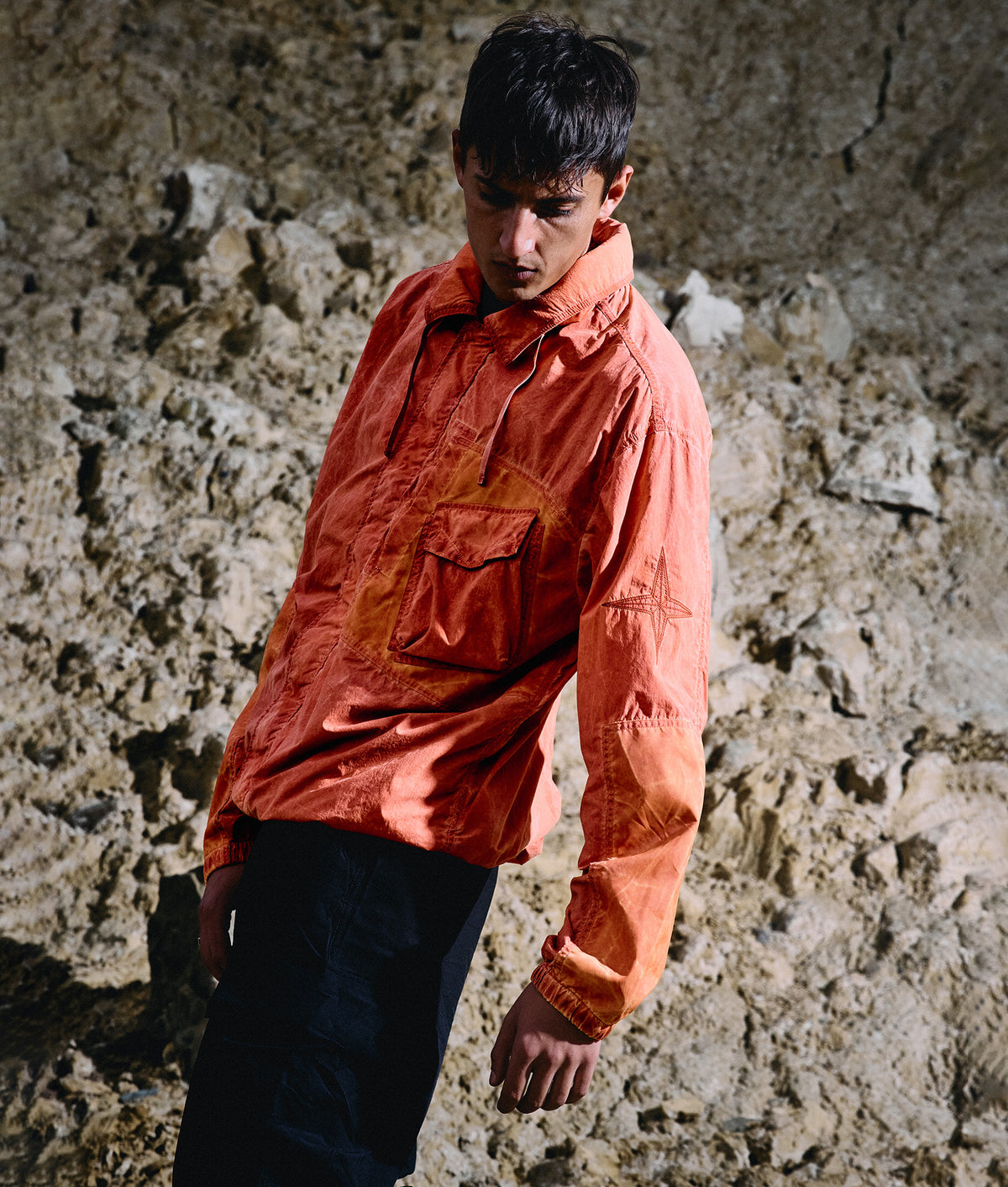 Stone Island Uneven Pigment Dyed Nylon Smerigliato + Nylon Canvas Overshirt in Burnt Orange at EQVVS Menswear. Campaign shot.