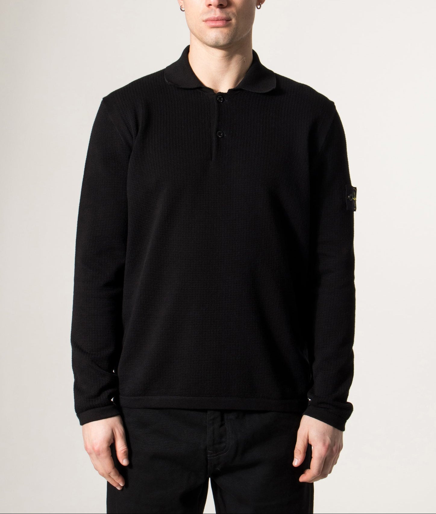 Stone Island Micro Stitch Organic Cotton Polo Shirt in Black at EQVVS Menswear. Model front shot.