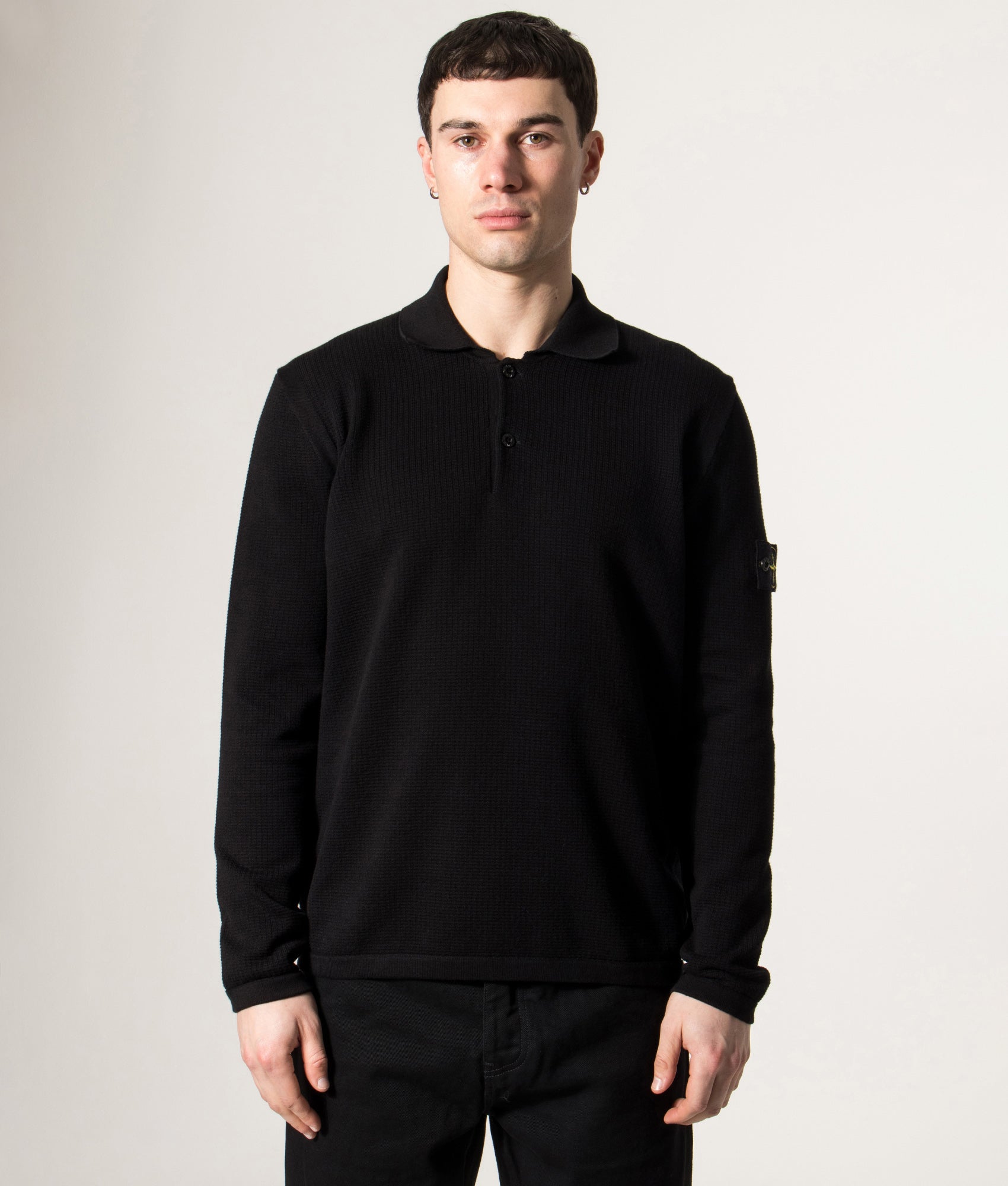 Stone Island Micro Stitch Organic Cotton Polo Shirt in Black at EQVVS Menswear. Model front shot.