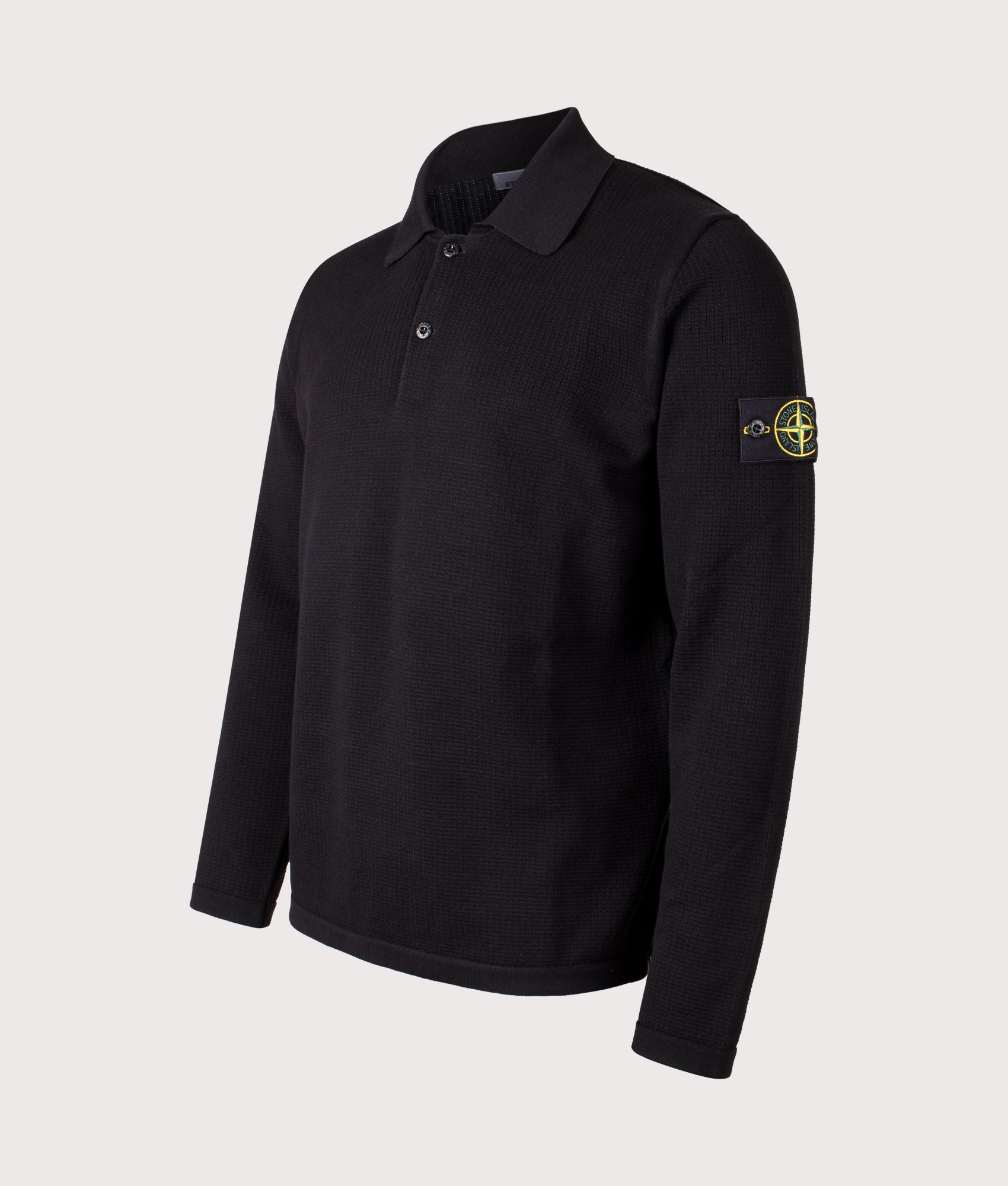 Stone Island Micro Stitch Organic Cotton Polo Shirt in Black at EQVVS Menswear. Angled front shot.