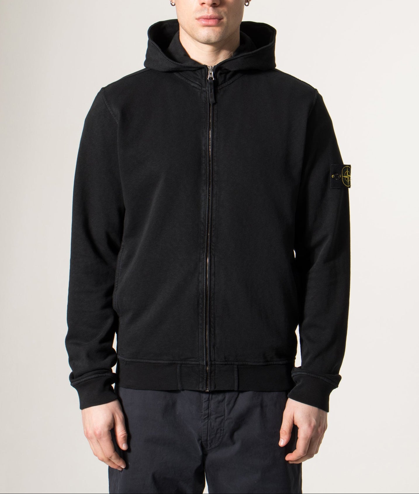 Stone Island Malfilé ‘Old’ Treatment Full Zip Hoodie in Black at EQVVS Menswear. Model front shot.