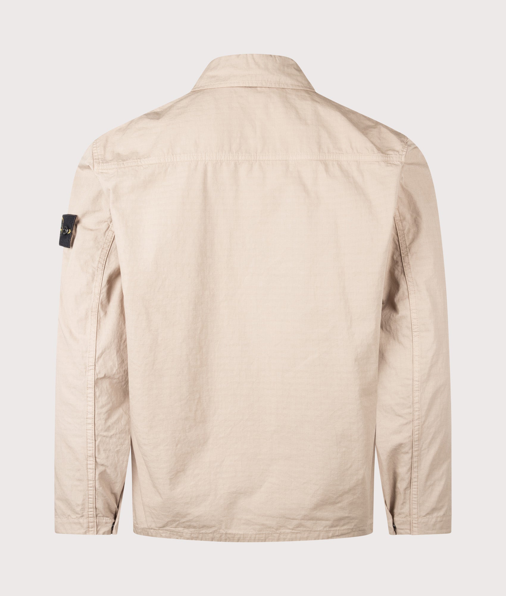 Stone Island Mercerised Organic Cotton Ripstop Overshirt in Desert Sand at EQVVS Menswear. Back detail shot.
