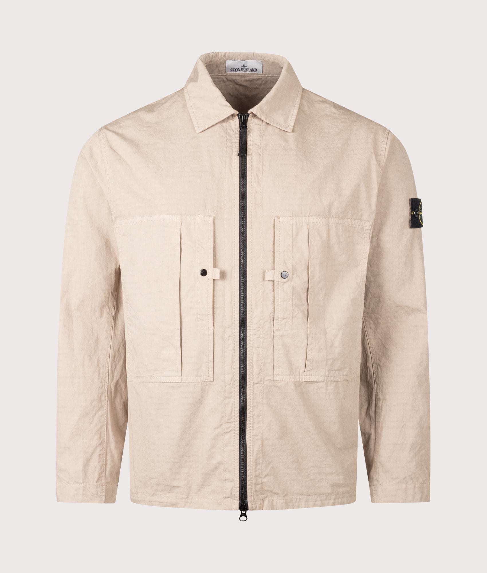 Stone Island Mercerised Organic Cotton Ripstop Overshirt in Desert Sand at EQVVS Menswear. Front shot.