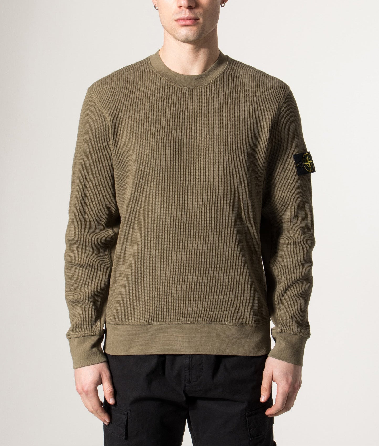 Stone Island Waffle Knit Sweatshirt in Military Green at EQVVS Menswear. Model front shot.