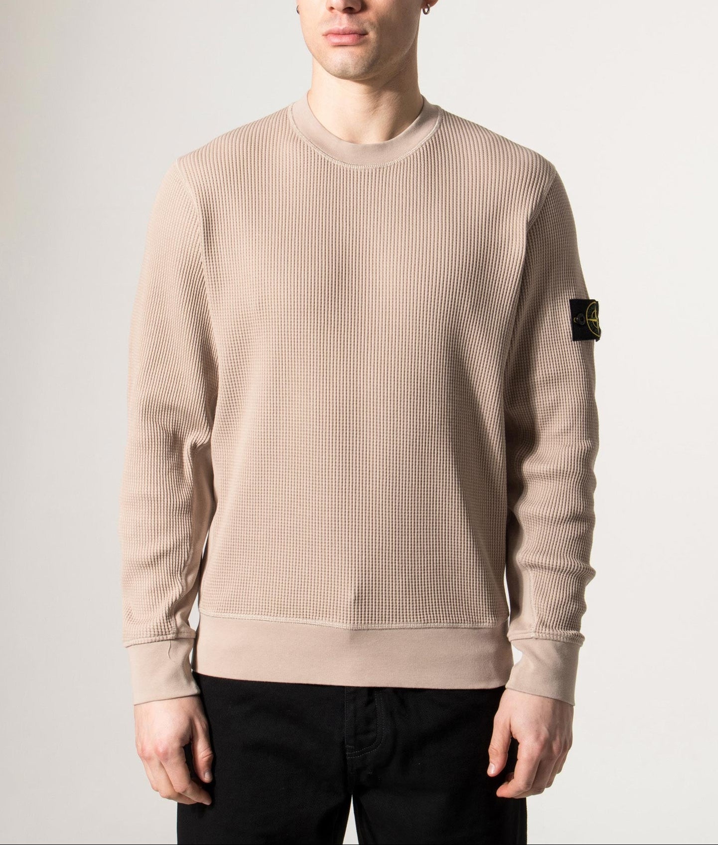 Stone Island Waffle Fleece Compass Sweatshirt in Desert Sand at EQVVS Menswear. Model front shot.
