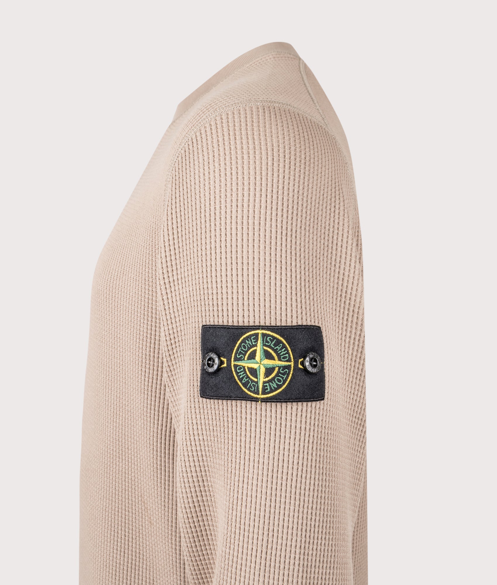 Stone Island Waffle Fleece Compass Sweatshirt in Desert Sand at EQVVS Menswear. Detail shot.