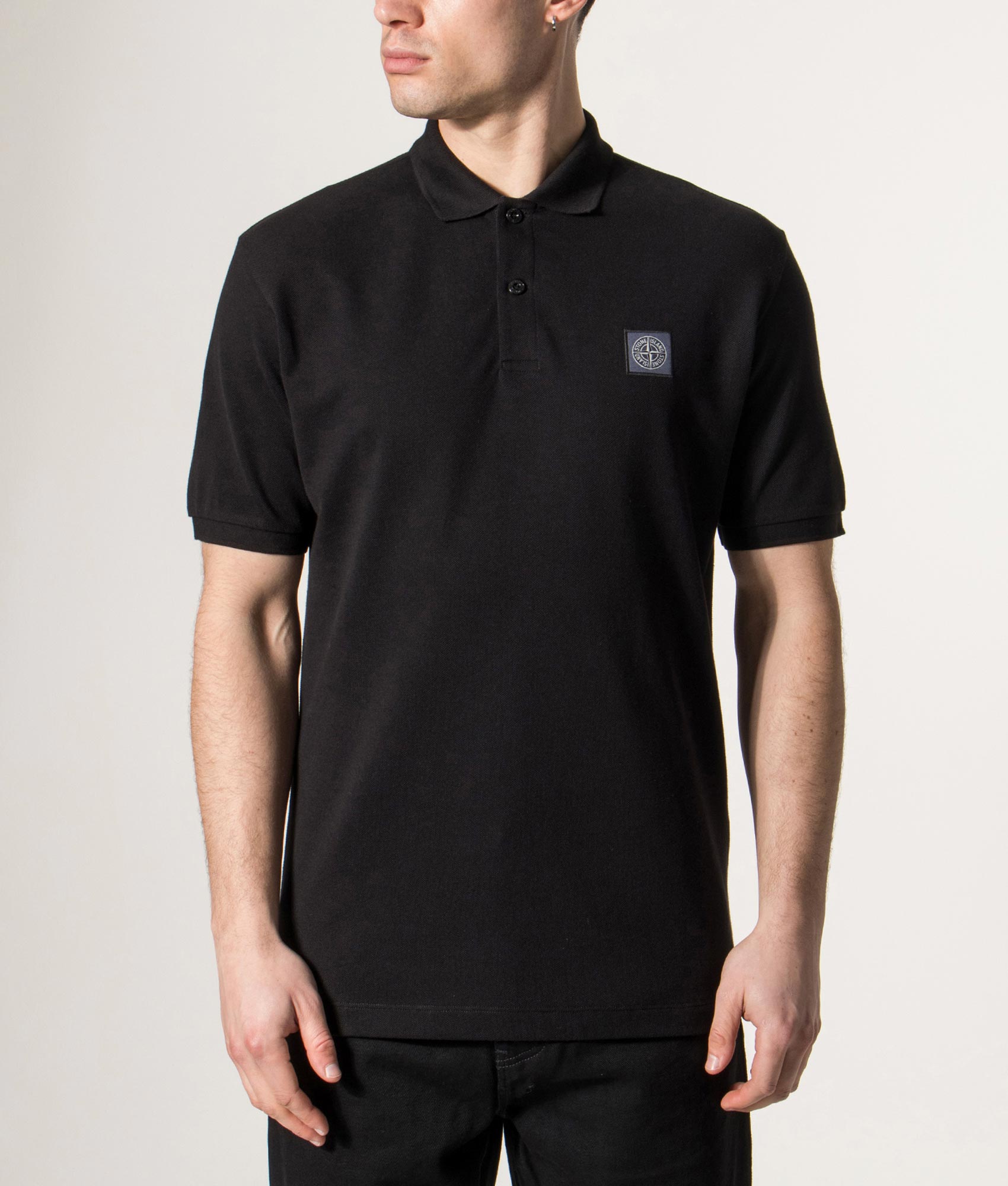 Stone Island Compass Patch Polo Shirt in Black at EQVVS Menswear. Detail shot.