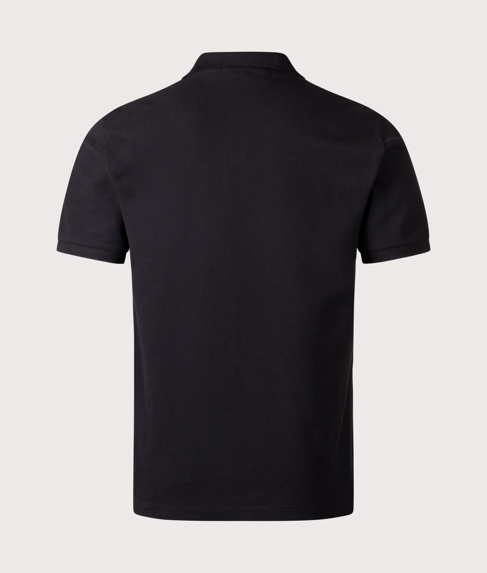 Stone Island Compass Patch Polo Shirt in Black at EQVVS Menswear. Back shot.