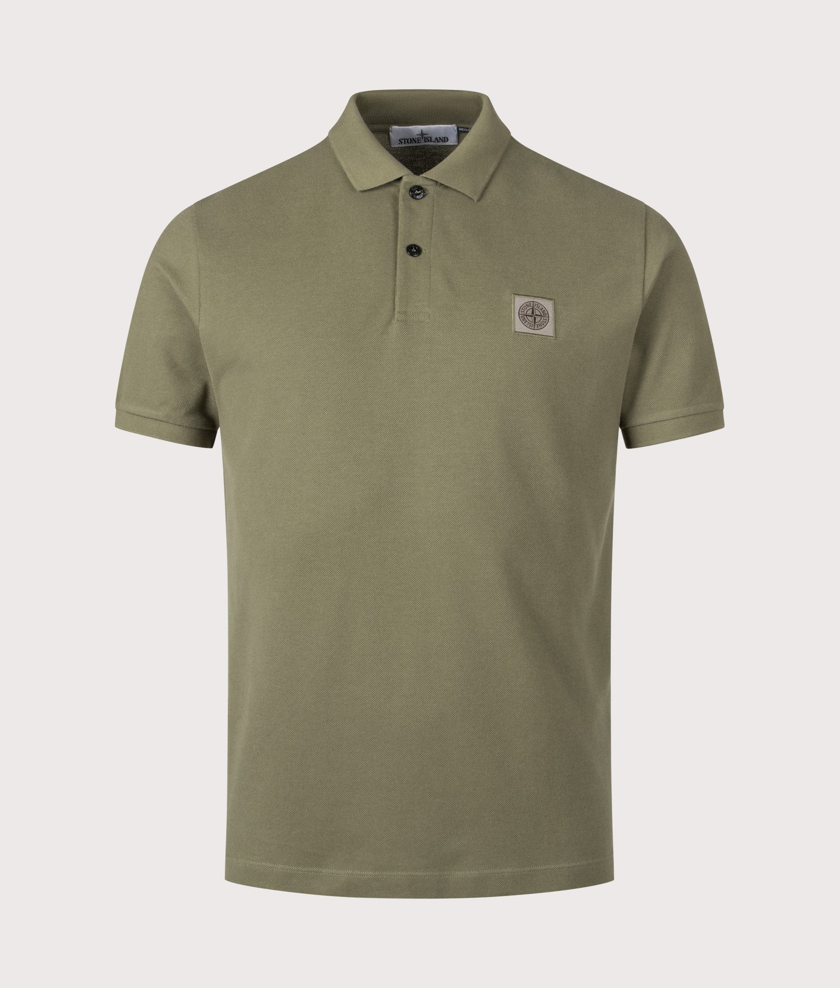 Stone Island Compass Patch Polo Shirt in Military Green at EQVVS Menswear. Front shot 