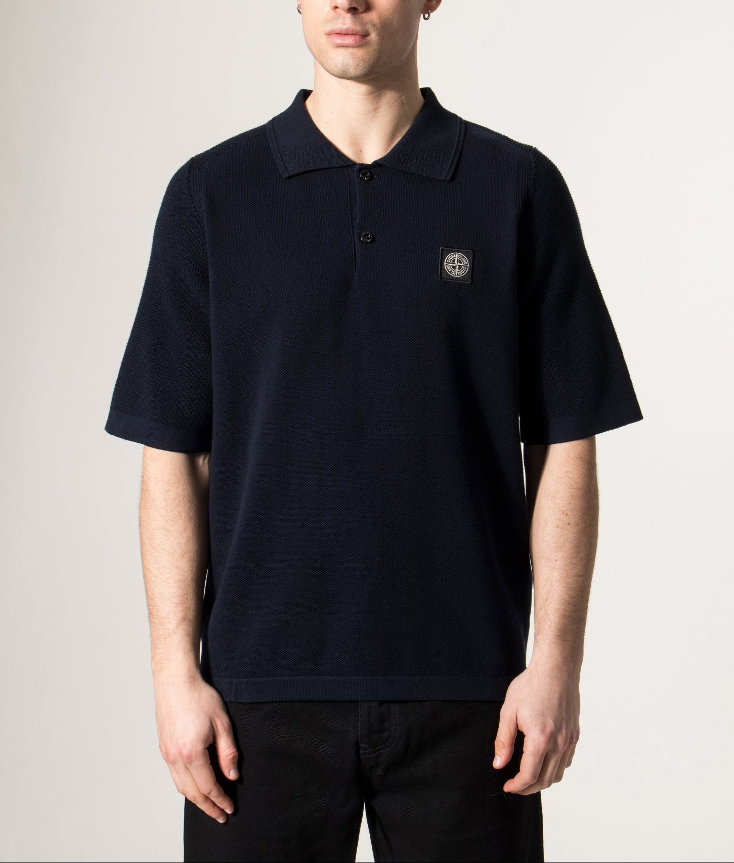 Micro Stitch Organic Cotton Compass Polo Shirt by Stone Island in Navy Blue  at EQVVS Menswear. Model front shot.