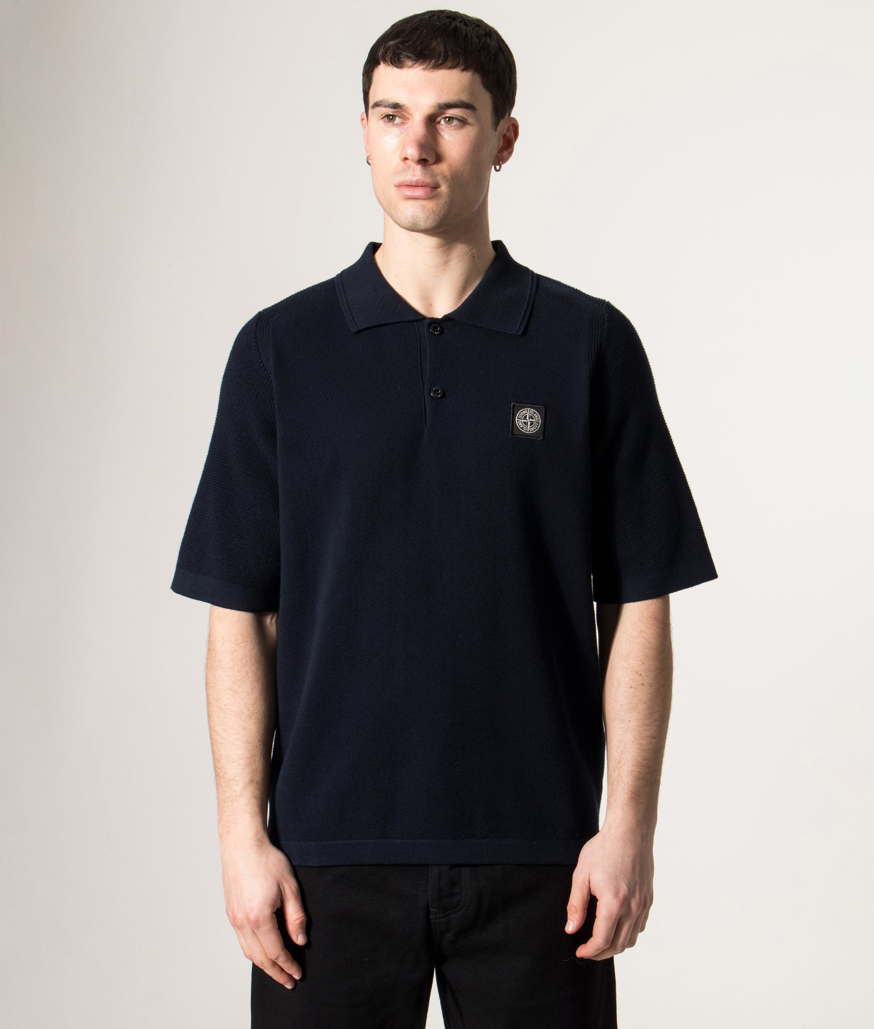 Micro Stitch Organic Cotton Compass Polo Shirt by Stone Island in Navy Blue  at EQVVS Menswear. Model front shot.