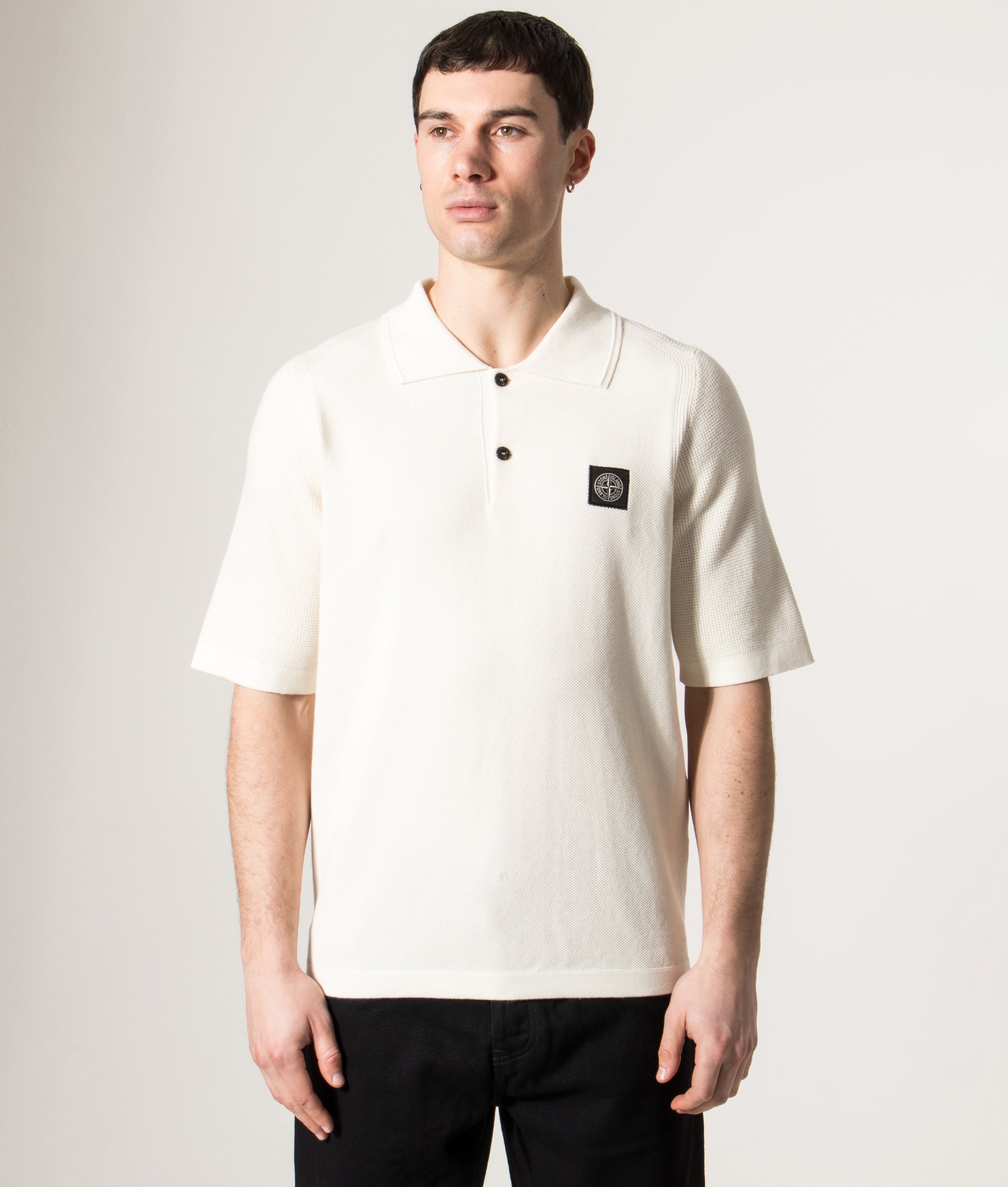 Relaxed Fit Micro Stitch Organic Cotton Compass Polo Shirt by Stone Island in Ivory at EQVVS Menswear. Model front shot.