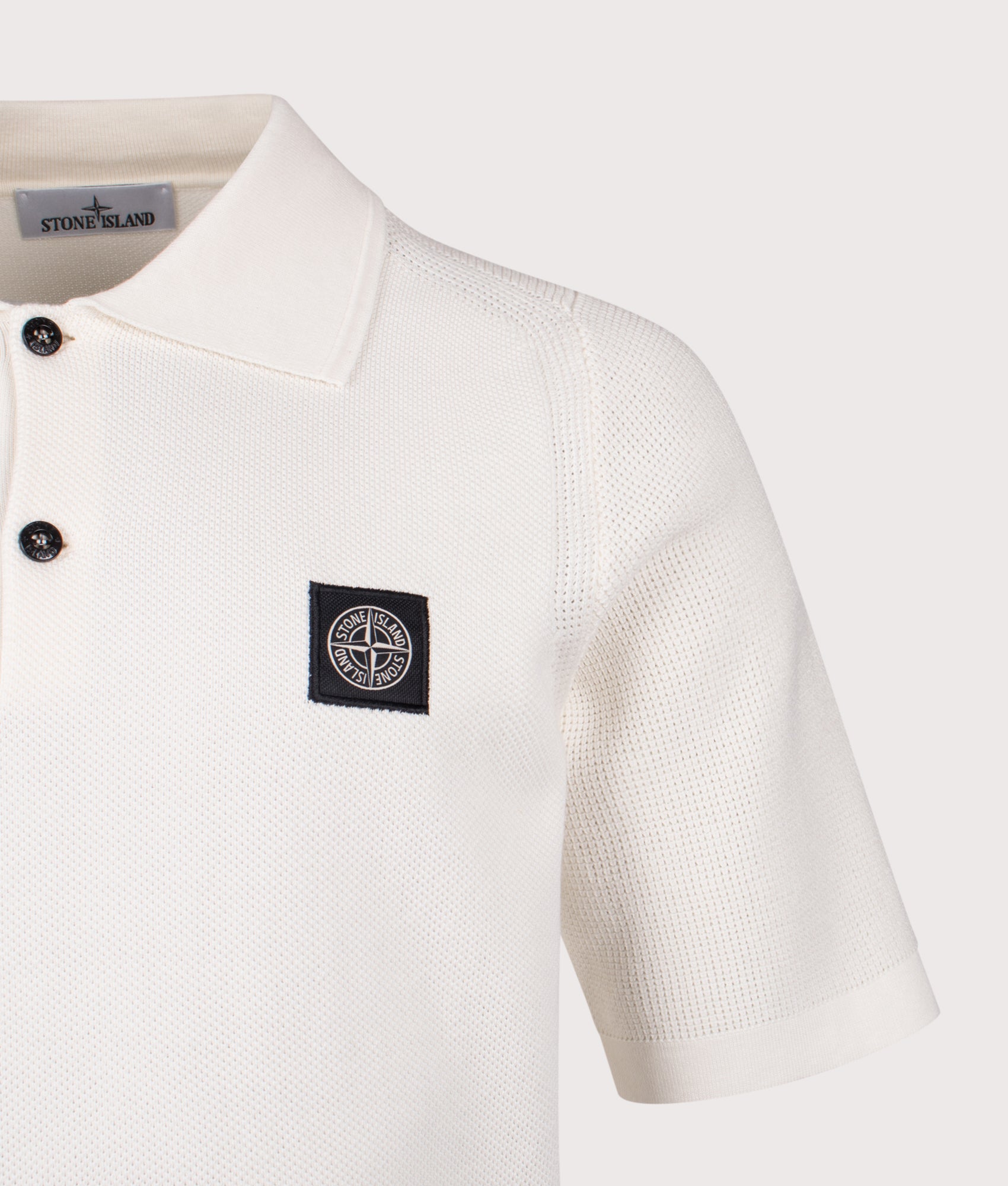 Relaxed Fit Micro Stitch Organic Cotton Compass Polo Shirt by Stone Island in Ivory at EQVVS Menswear. Detail shot.