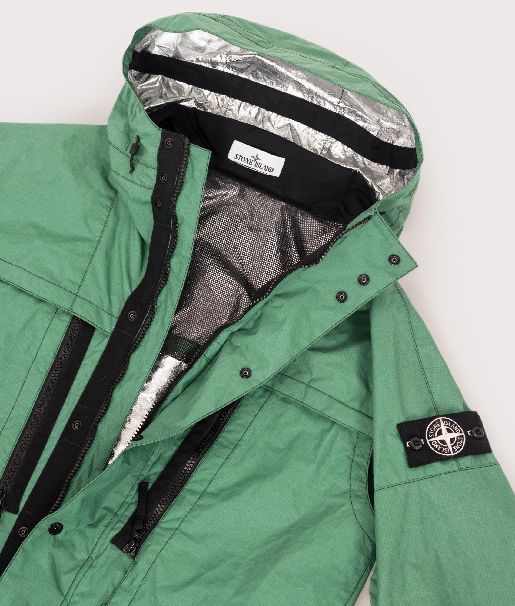 Stone Island Metal Lamina Ripstop Heat Reactive Jacket in Malachite at EQVVS Menswear. Open shot.