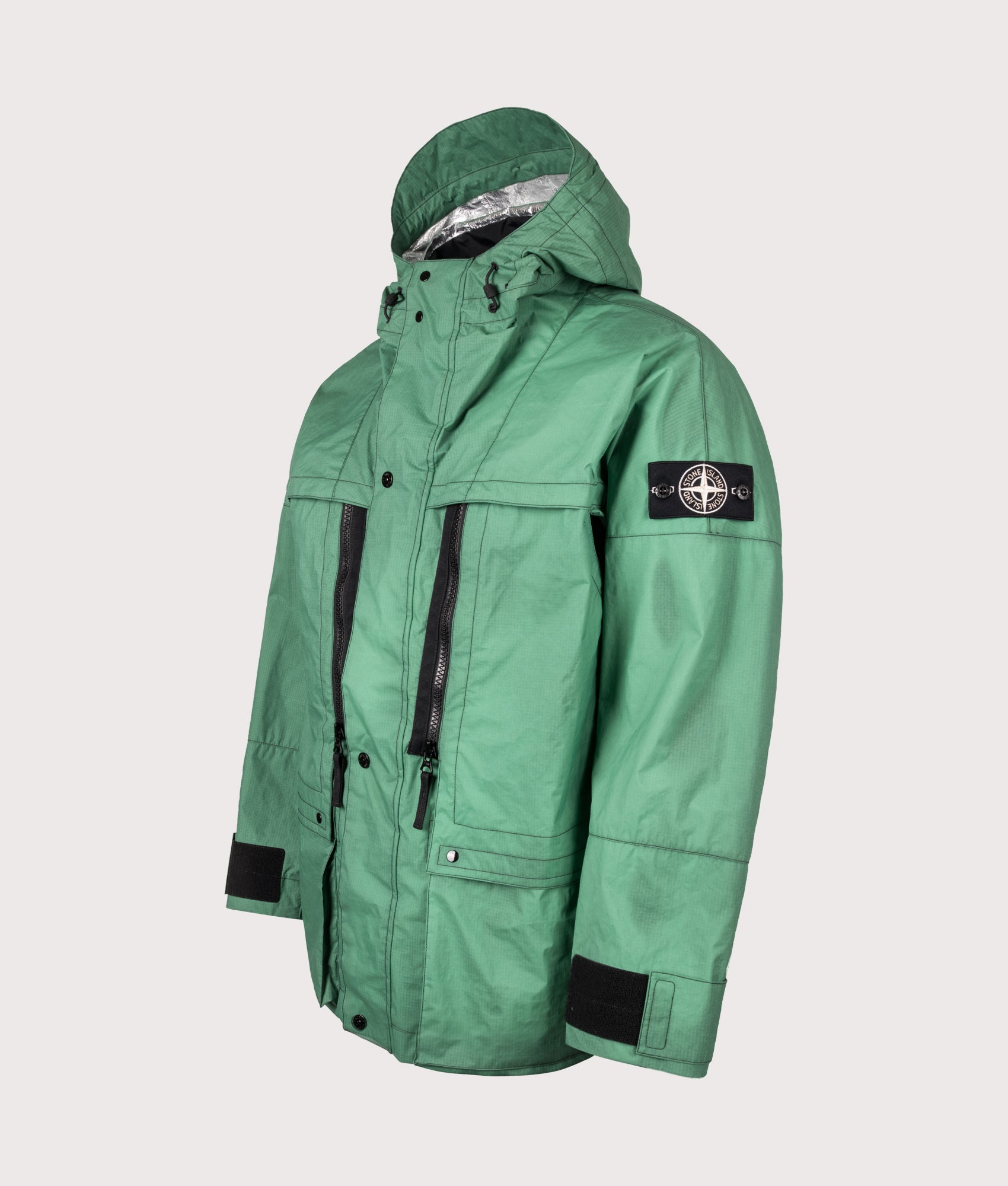 Stone Island Metal Lamina Ripstop Heat Reactive Jacket in Malachite at EQVVS Menswear. Angled front shot.