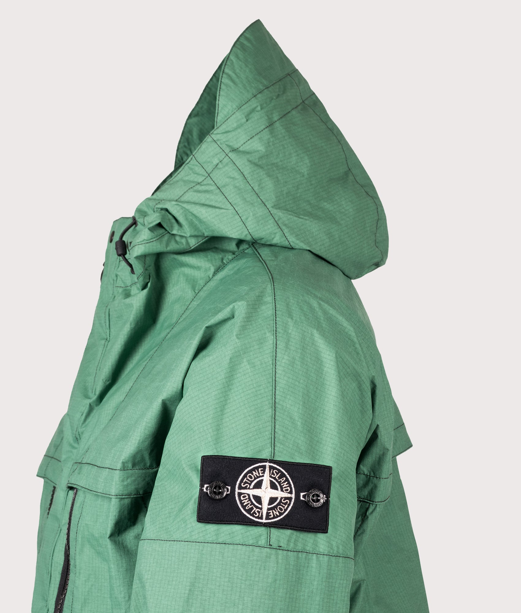 Stone Island Metal Lamina Ripstop Heat Reactive Jacket in Malachite at EQVVS Menswear. Side detail shot.