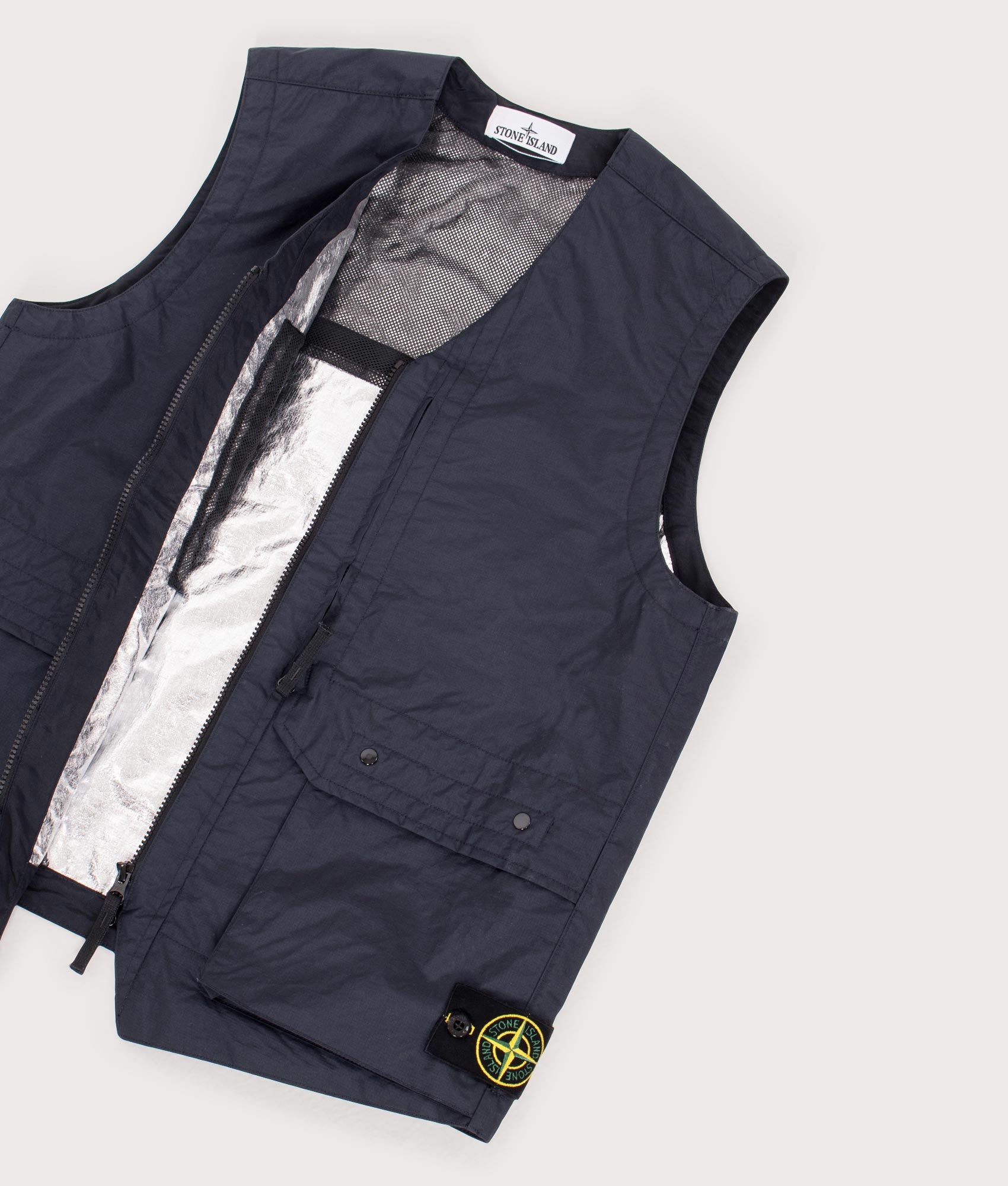 Stone Island Metal Lamina Poly Ripstop Vest in Navy Blue at EQVVS Menswear. Flat open shot.