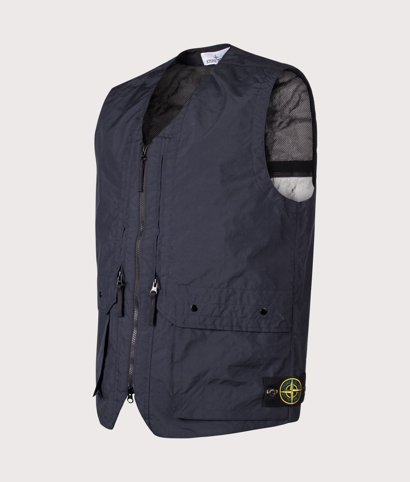 Stone Island Metal Lamina Poly Ripstop Vest in Navy Blue at EQVVS Menswear. Angled front shot.
