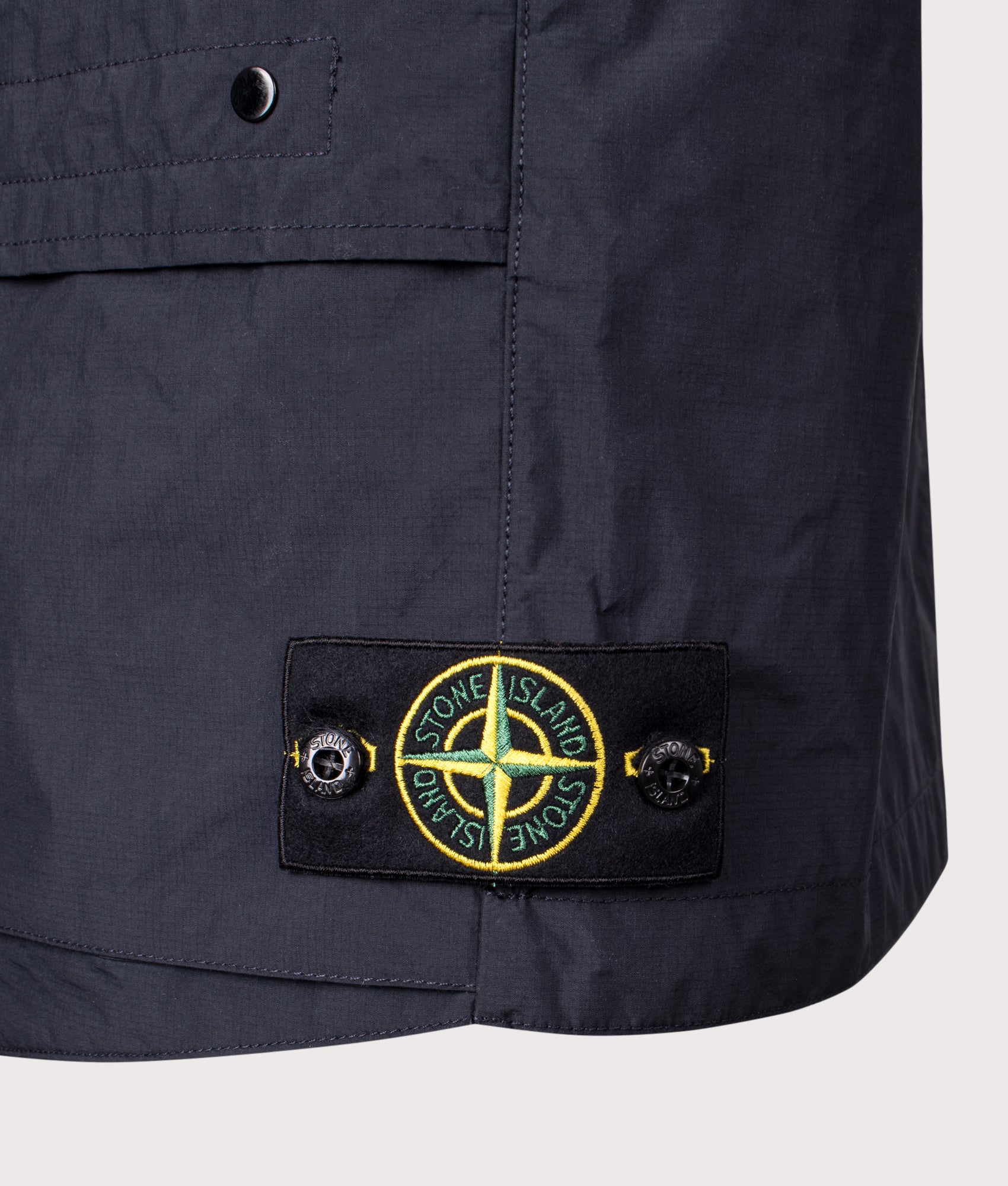 Stone Island Metal Lamina Poly Ripstop Vest in Navy Blue at EQVVS Menswear. Detail shot.