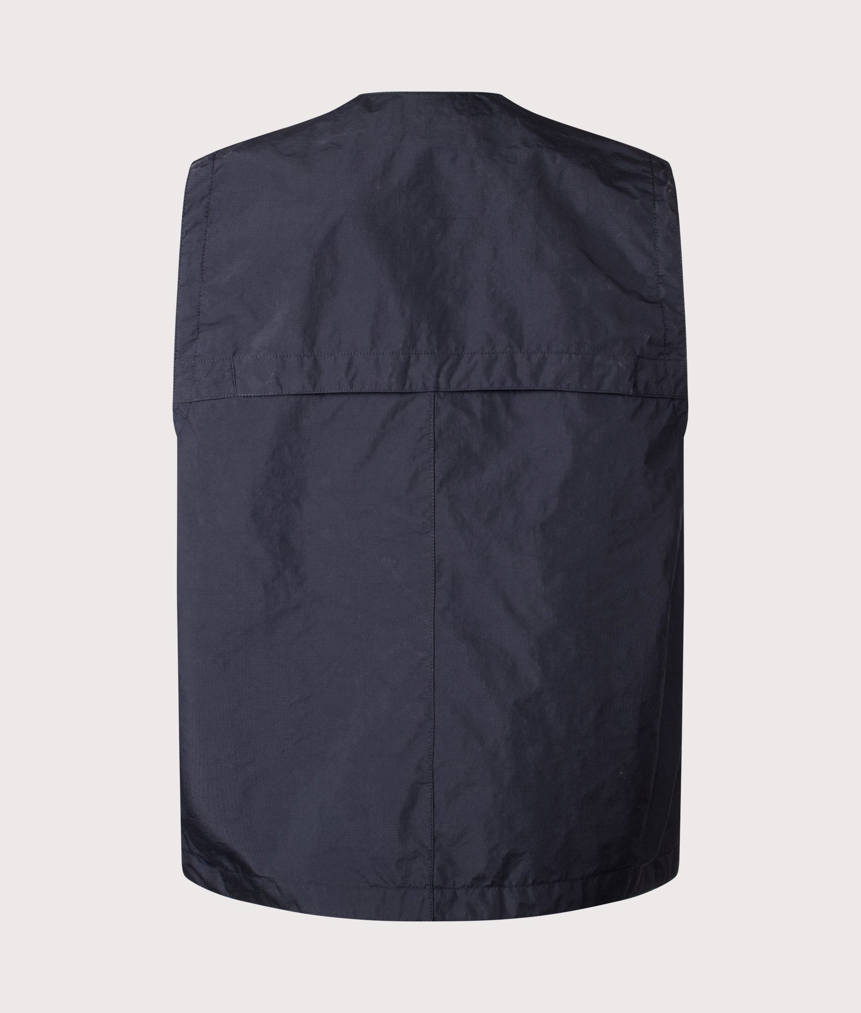 Stone Island Metal Lamina Poly Ripstop Vest in Navy Blue at EQVVS Menswear. Back shot.