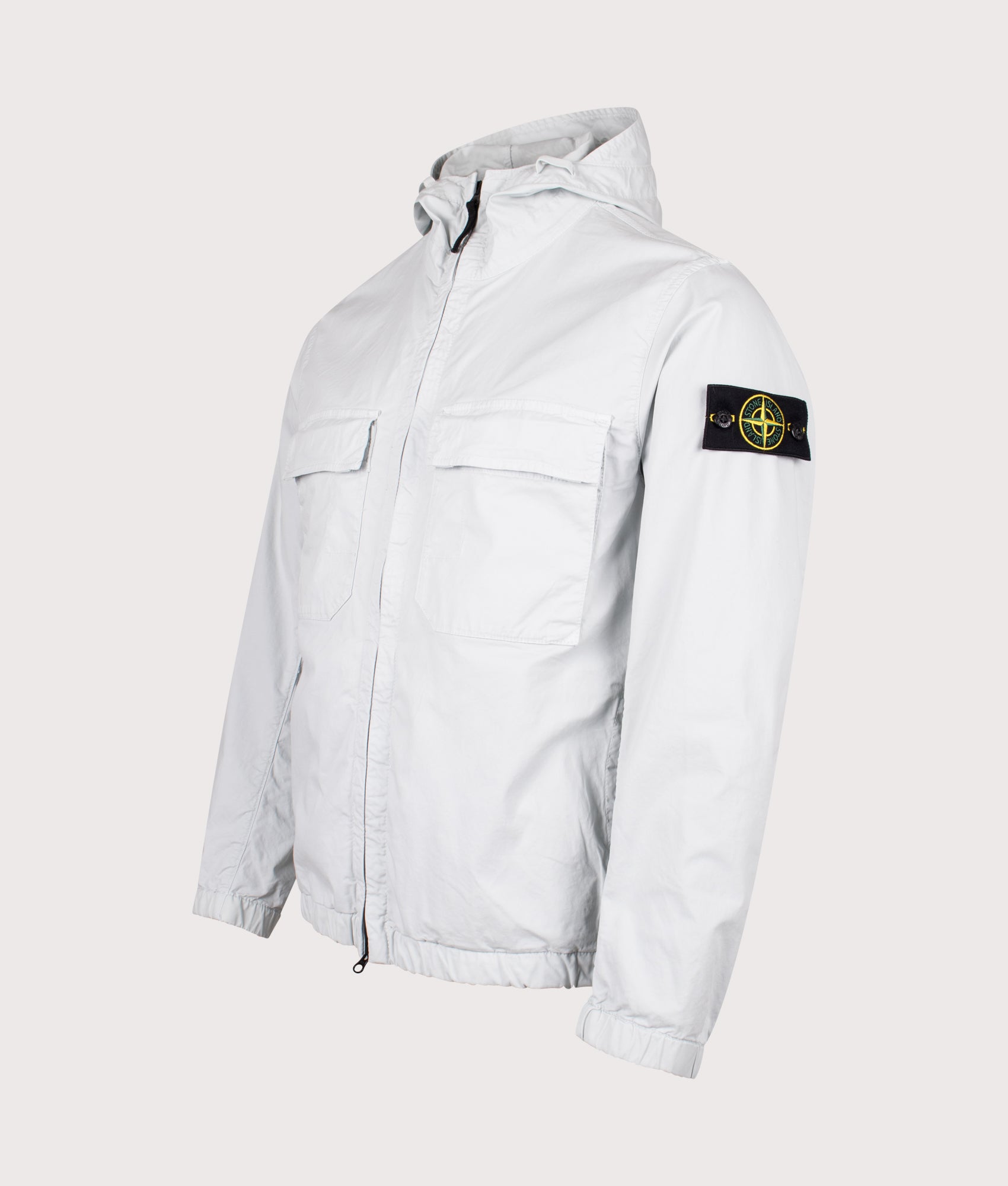 Stone Island Hooded Field Jacket in Sky Blue at EQVVS Menswear. Angled front shot.