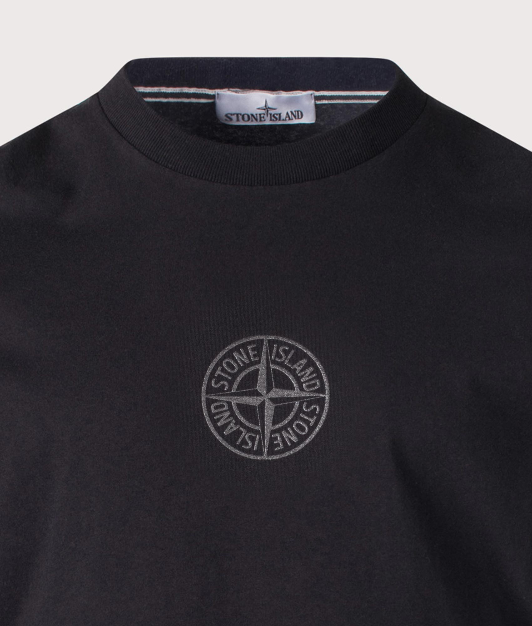Stone Island ‘Camo Compass’ Print T-Shirt in Black at EQVVS Menswear. Detail shot.