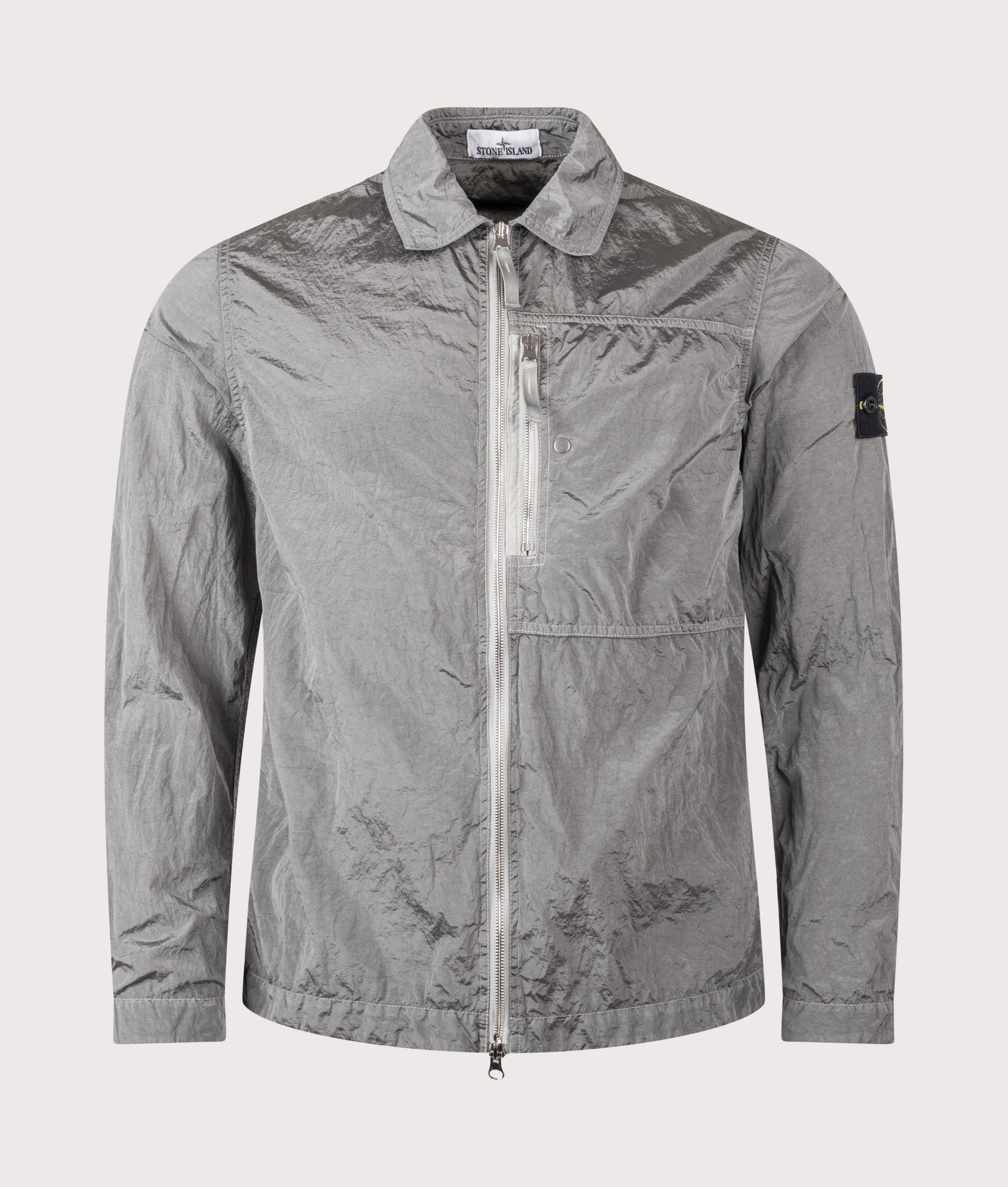 Stone Island Nylon Metal in ECONYL® Overshirt in Pearl Grey at EQVVS Menswear. Front shot.